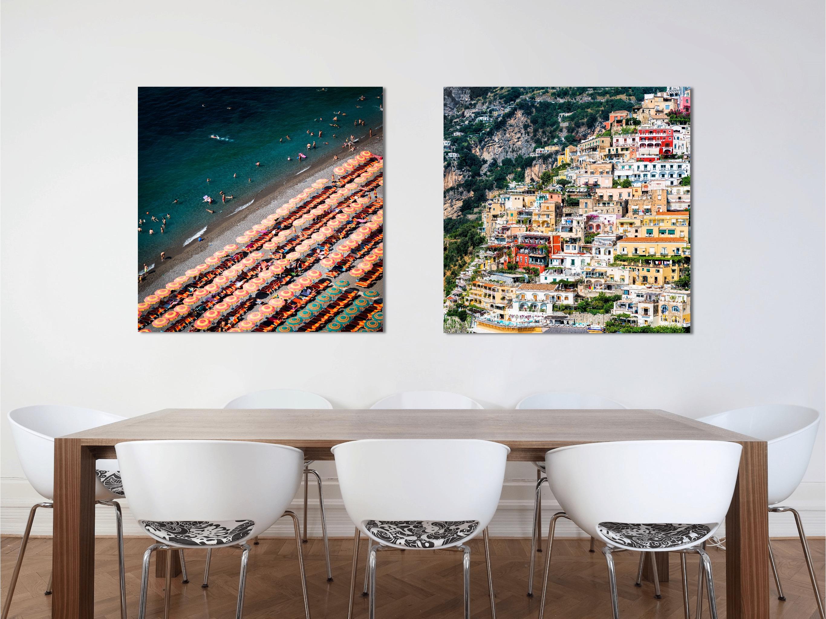 This contemporary coastal photograph by Peter Mendelson captures a sunny, summer day on a beach along the Amalfi Coast in Italy. The title, meaning 