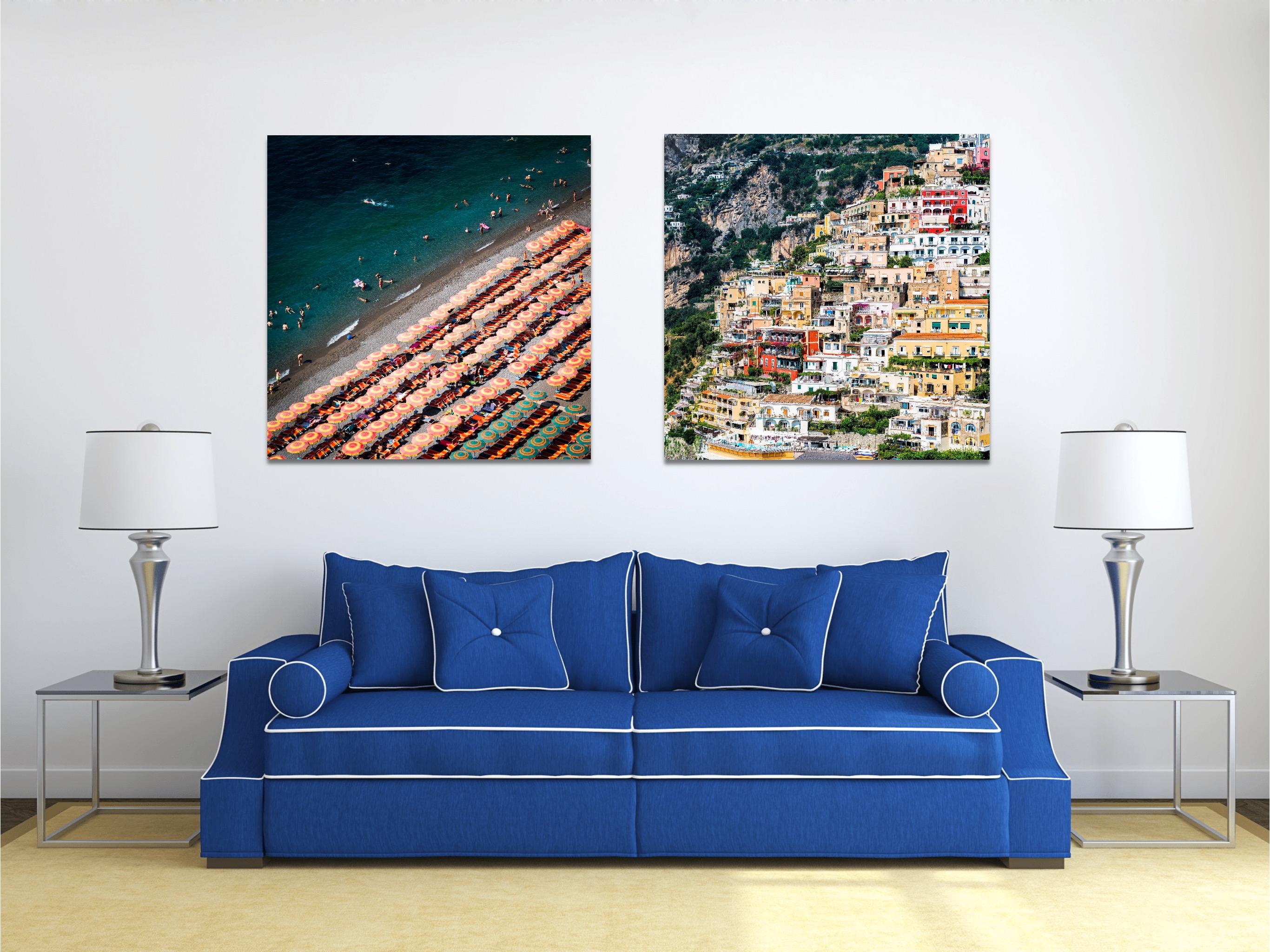 This contemporary coastal photograph by Peter Mendelson captures a sunny, summer day on a beach along the Amalfi Coast in Italy. The title, meaning 