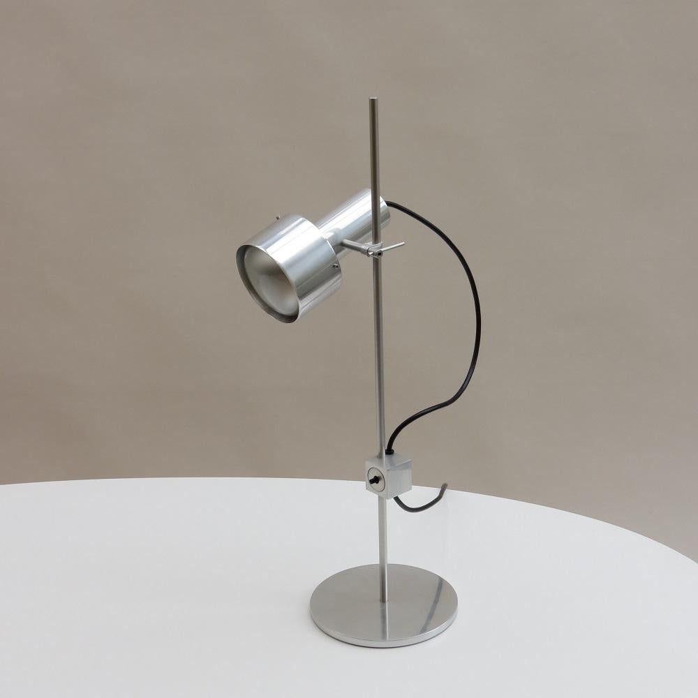 Peter Nelson Aluminium Single Spot Desk Lamp early 1960s

Wonderful desk lamp designed by Peter Nelson and produced by Architectural Lighting Ltd. With a single spot light, fully adjustable lamp which moves up and down the rod and also tilts to the