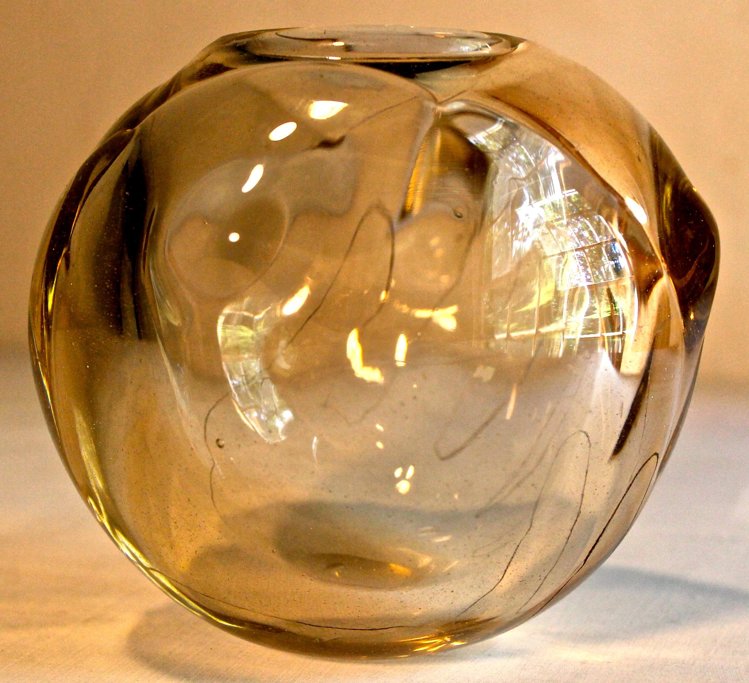 Amber glass with a meandering etched line outlining a hand holding the bowl. Signed and dated 1980, and annotated as a gift in 1982.

Peter Pellettieri (1939-1997), was a Fulbright Scholar and recipient of a grant from the Italian Government. His