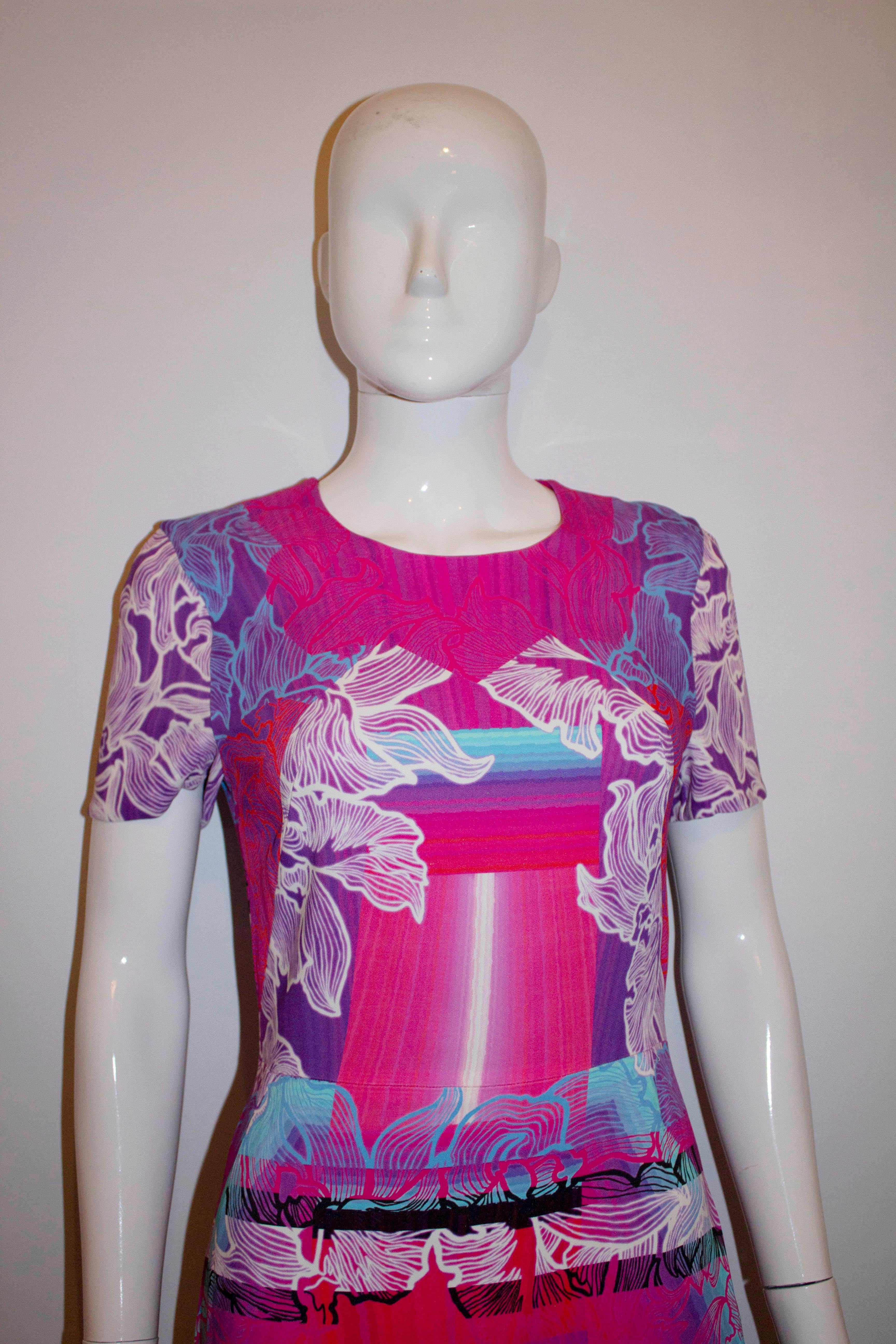 A fun day dress by Peter Pilotto.  In a colourful combination of pink, purple and cream, the dress as a back central zip and is fully lined. UK size 8, Bust 35'',length 39''