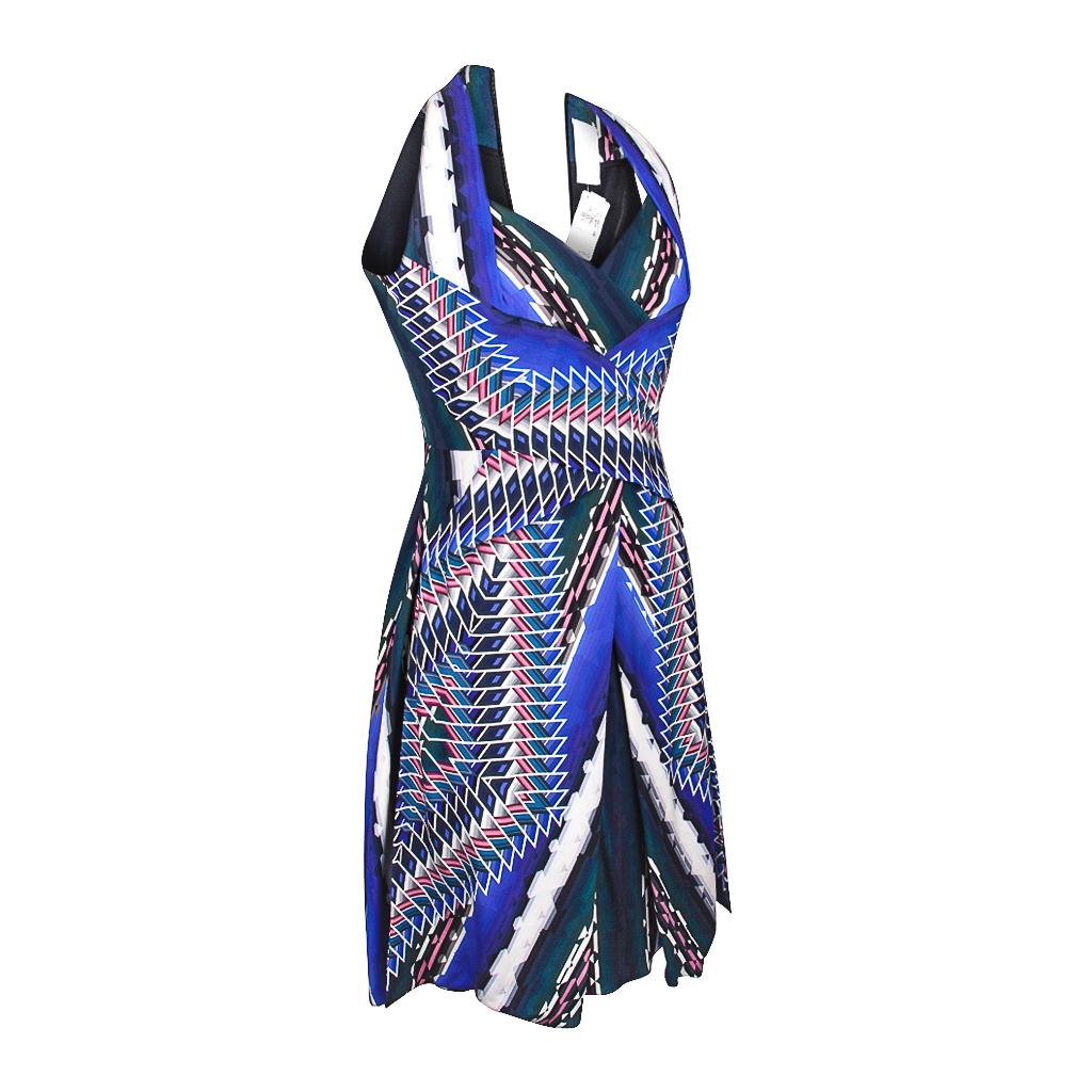 Guaranteed authentic Peter Pilotto abstract print dress with beautiful body flattering details. 
Empire and waist detail gives the illusion of a halter dress in front.
Front 'skirt' has wonderful movement.
Rear is straight with racer back