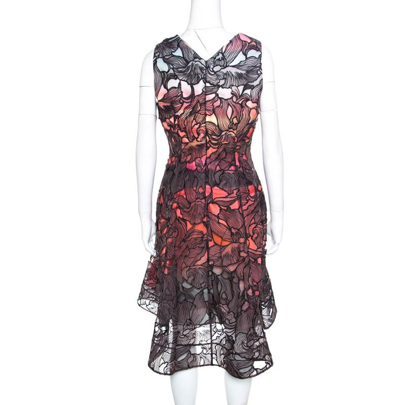 You'll leave the crowds amazed and make heads turn in this beautiful Eclipse dress from Peter Pilotto! The lovely creation is made of 100% silk and features a multicolour printed pattern all over it. The floral lace overlay makes the dress look