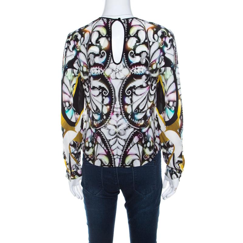 We love this blouse from Peter Pilotto as it is high in style and appeal. It comes flaunting long sleeves, a round neck and prints in multiple colours splayed all over. You can team it with pants or skirts and high heels.

Includes: The Luxury