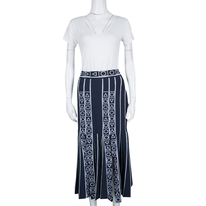 Wear this exclusive, fashionable midi skirt and add a voguish touch to your presence. It comes designed in navy blue and white with slits and zip fastening. You can wear a simple top and ankle strap sandals with this appealing creation from Peter