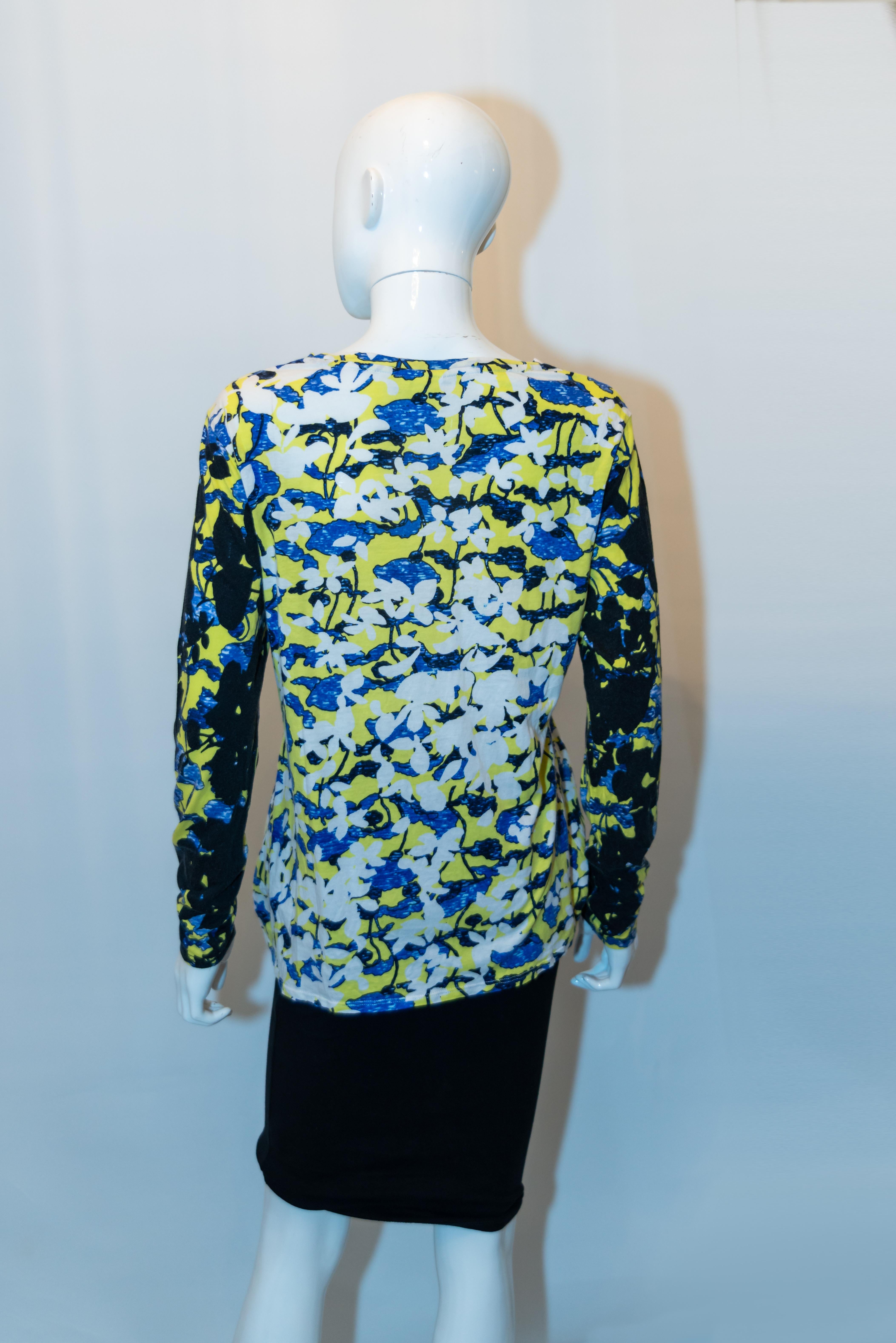 A head turning printed T shirt by Peter Pilotto. The t shirt is in a cotton mix with the print reversed on the sleaves,  Measurements: Bust up to 40'' , length 25''