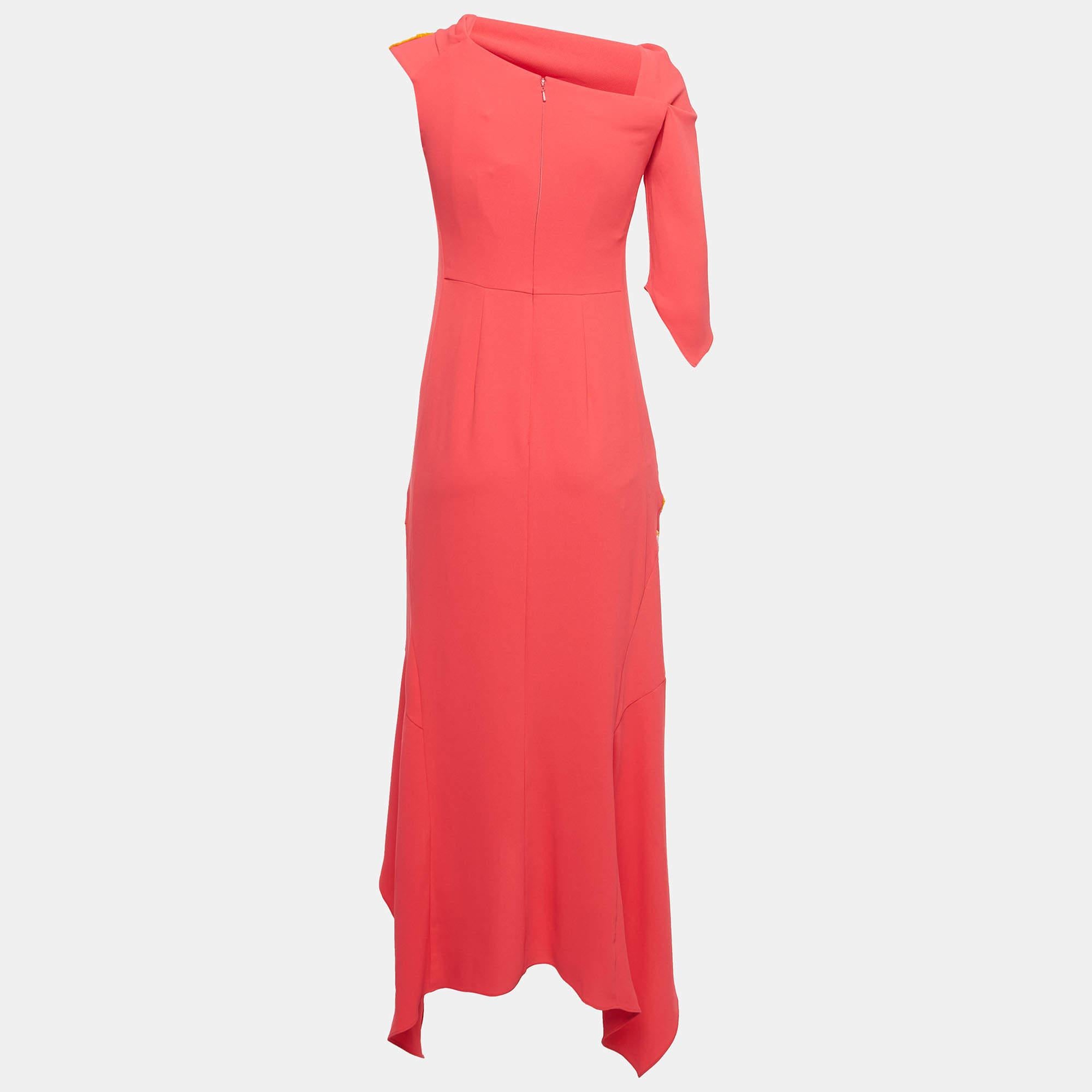 The Peter Pilotto gown is a breathtaking masterpiece. Crafted with exquisite attention to detail, it features a vibrant red hue, delicate off-shoulder design, and luxurious chenille cady fabric, exuding elegance and sophistication with every