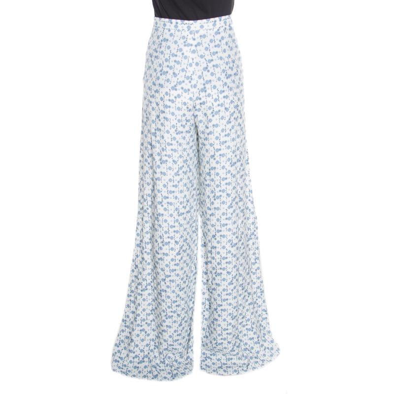 With pants as lovely as these Peter Pilotto ones, you are sure to win compliments from one and all! The white and blue pants are made of 100% viscose and feature a lovely floral print all over. They flaunt a wide leg silhouette and come equipped