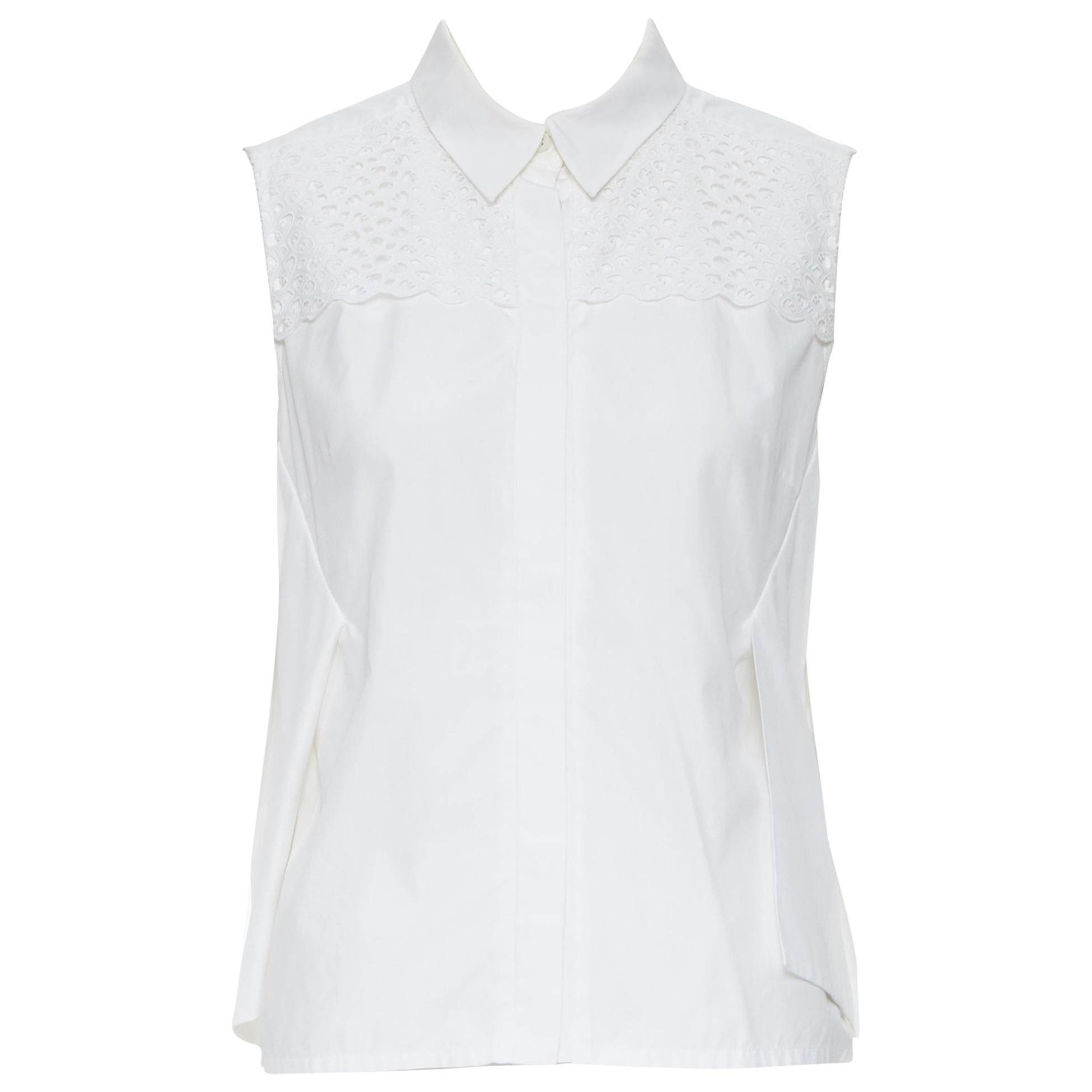 PETER PILOTTO white cotton embroidery anglais paneled panel sleeveless shirt S
Brand: Peter Pilotto
Designer: Peter Pilotto
Model Name / Style: Cotton shirt
Material: Cotton
Color: White
Pattern: Solid
Closure: Button
Extra Detail: Concealed button