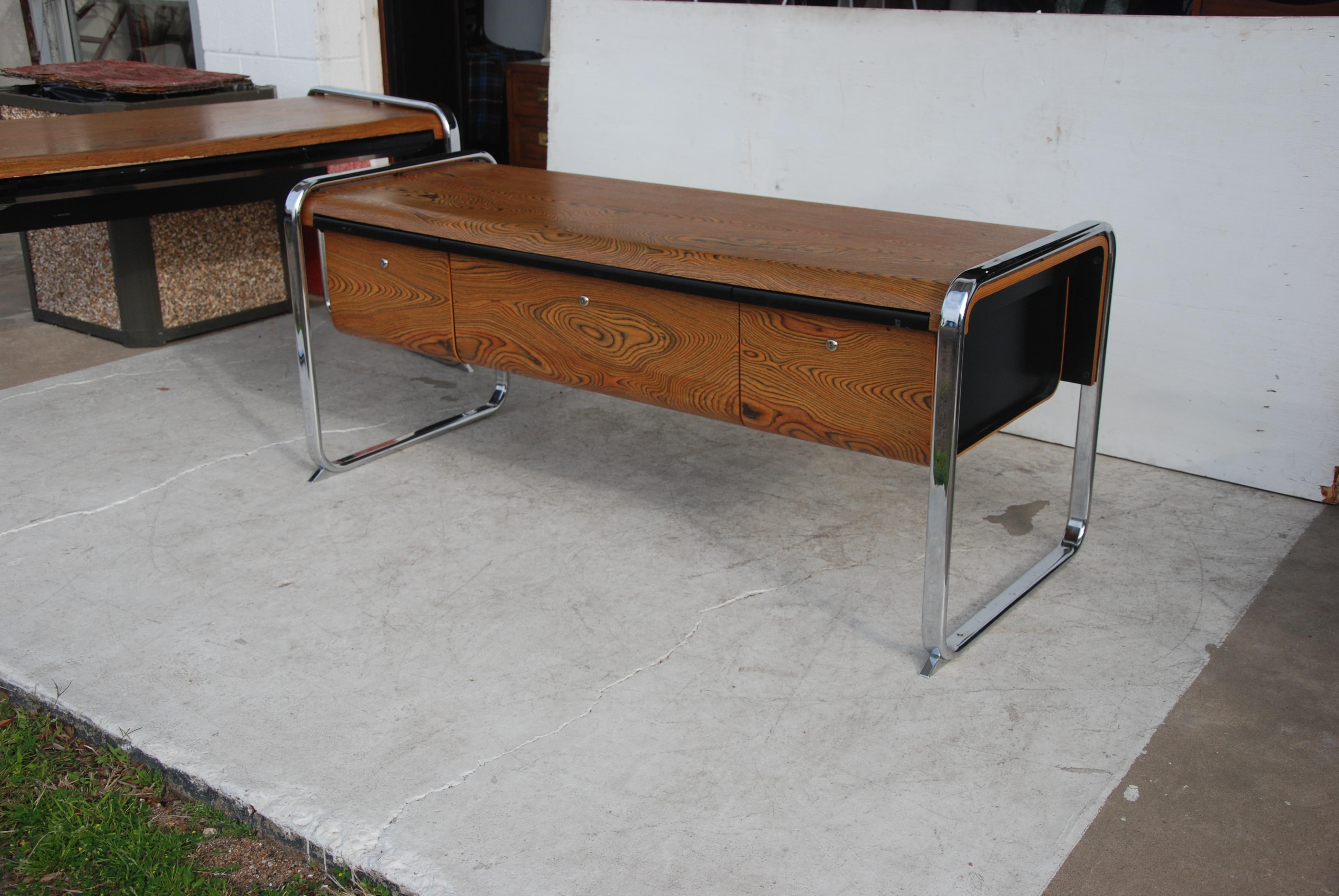 Credenza designed by Peter Protzmann for Herman Miller in the 1970s. This was a limited production run. Made from exotic African zebra-wood and supported by a chrome frame and three drawers.

 