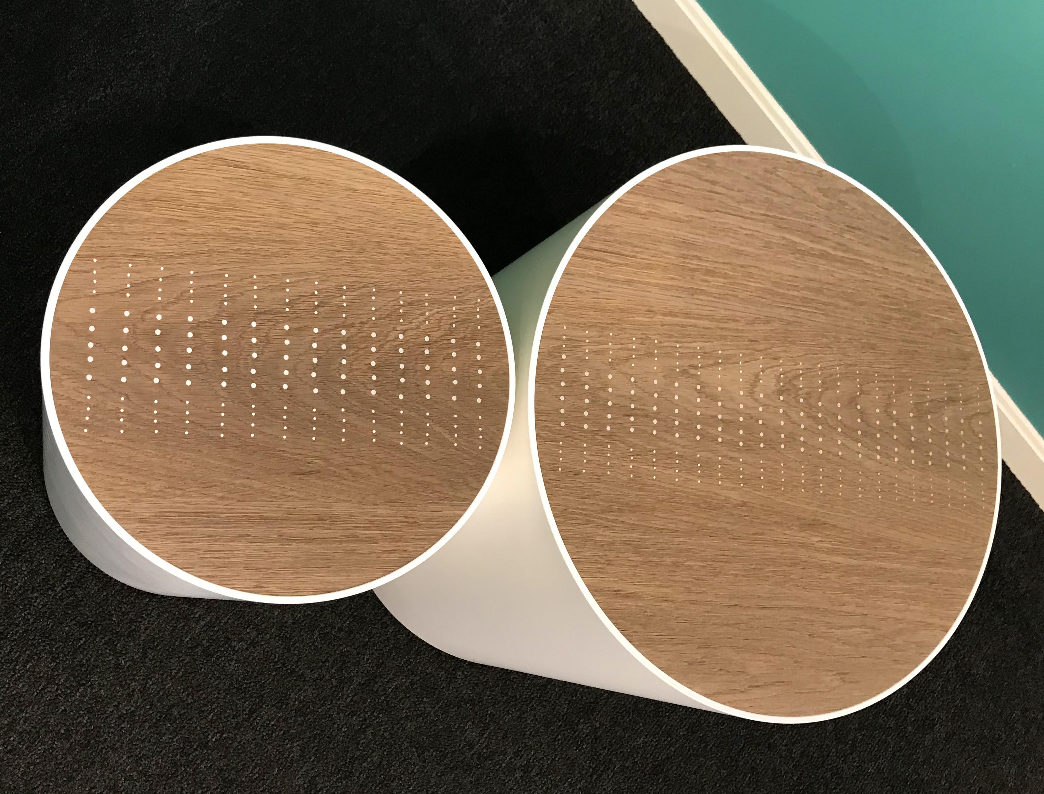 A fine custom modernist pair of drum tables, handcrafted by Peter Sandback. Sandback has gained a national reputation for his intricate pattern work of inlaid nails set into Minimalist handmade tables, benches and other functional forms that he