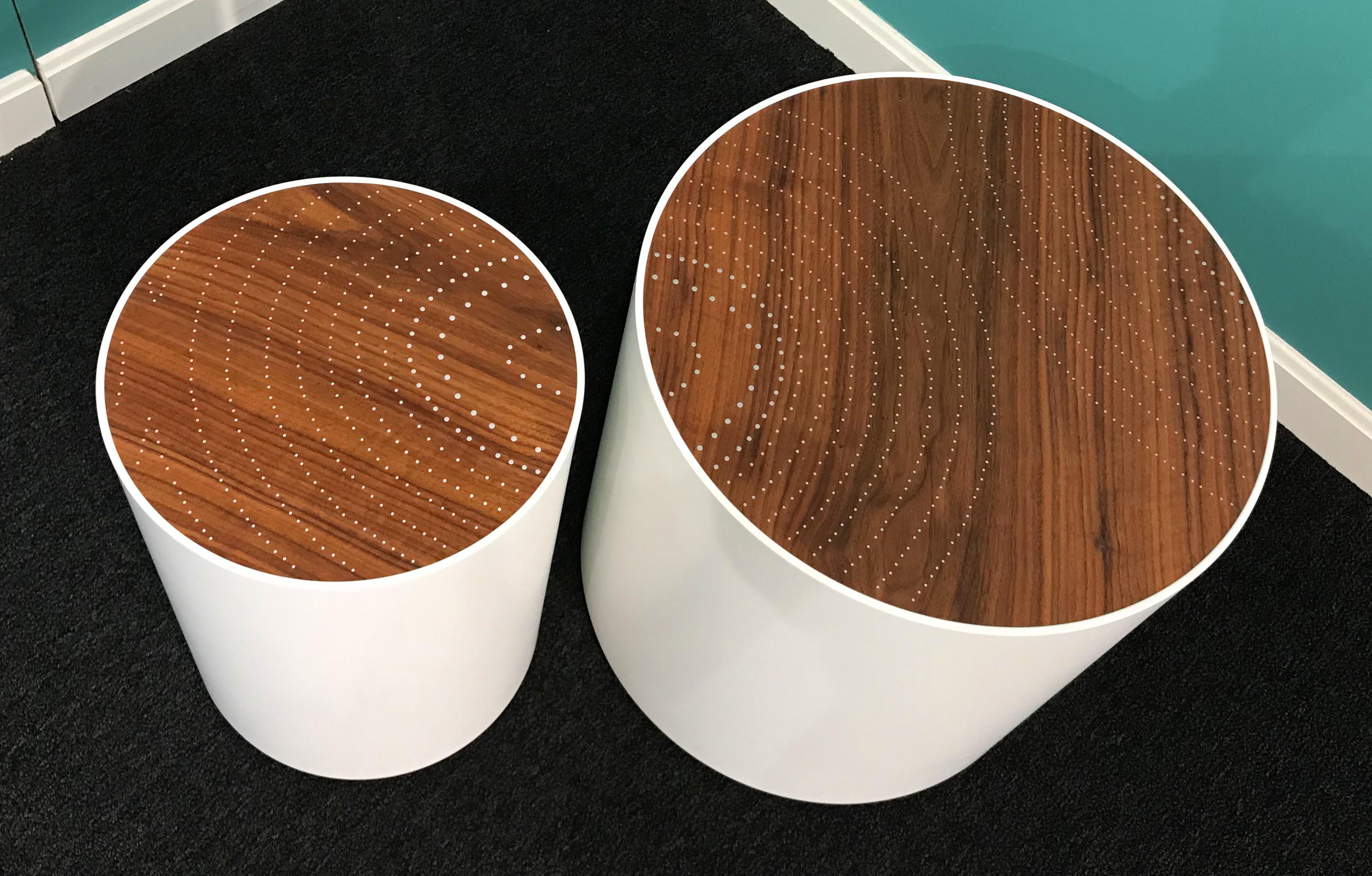 A fine custom modernist set of two drum tables, handcrafted by Peter Sandback. Sandback has gained a national reputation for his intricate pattern work of inlaid nails set into Minimalist handmade tables, benches and other functional forms that he