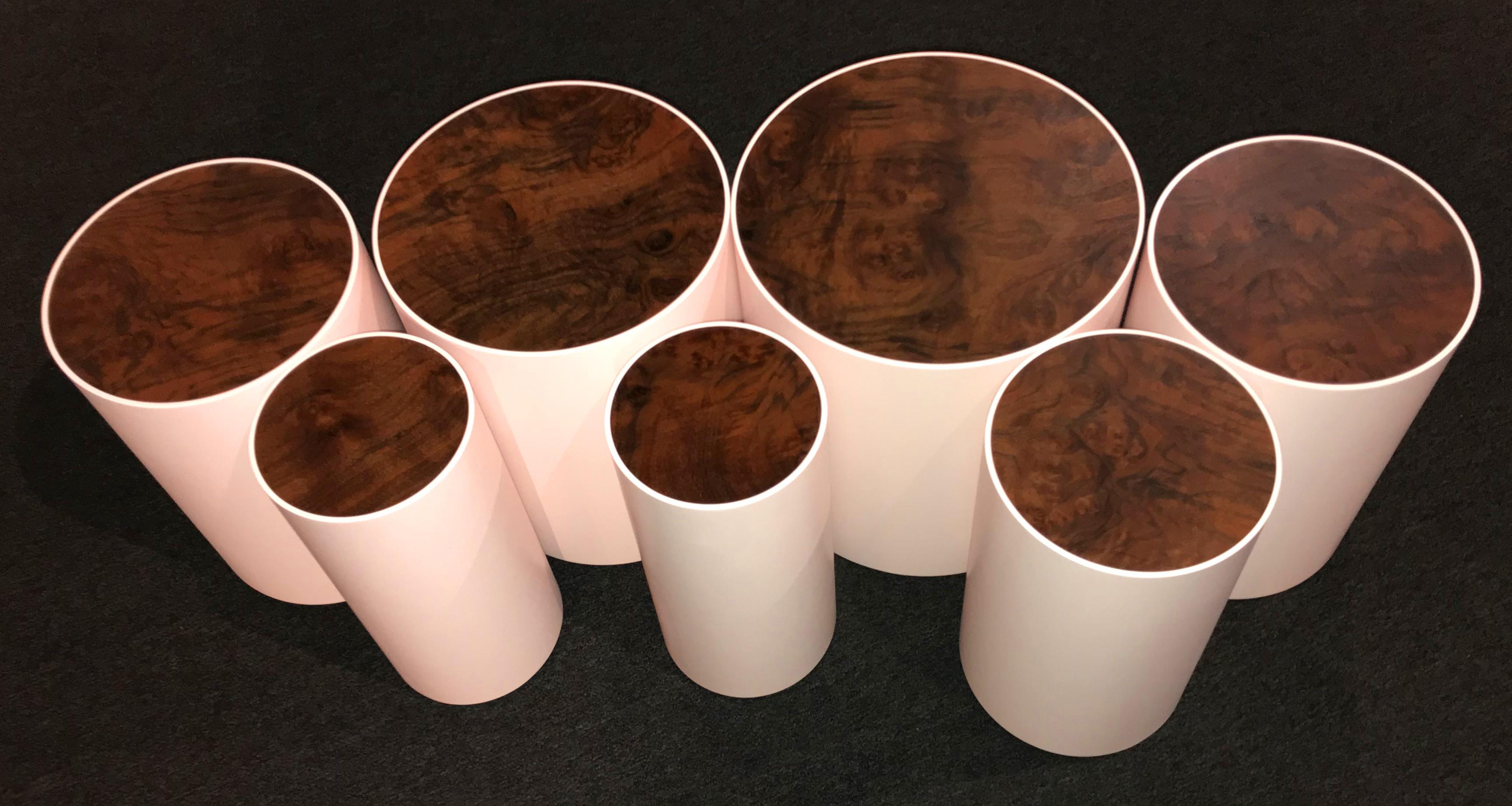 A fine custom modernist set of seven drum tables, handcrafted by Peter Sandback. Sandback has gained a national reputation for his intricate pattern work of inlaid nails set into Minimalist handmade tables, benches and other functional forms that he