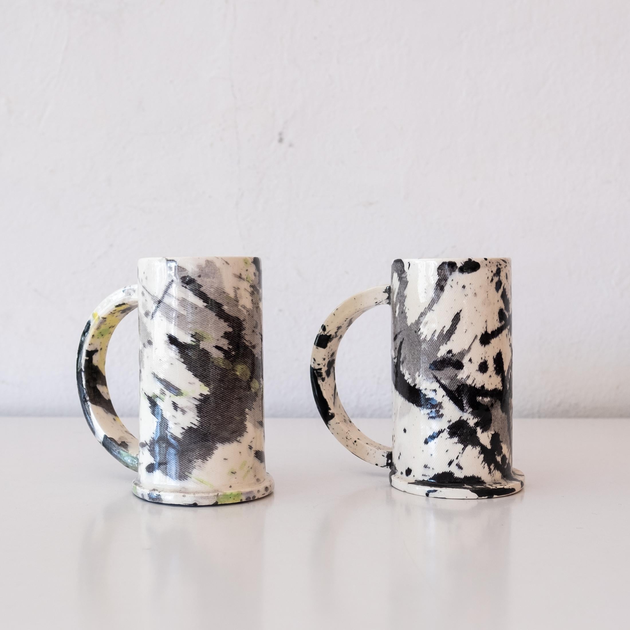 A pair of ceramic love cups by Peter Shire, a Los Angeles-based artist and founding member of The Memphis Group. Signed 
