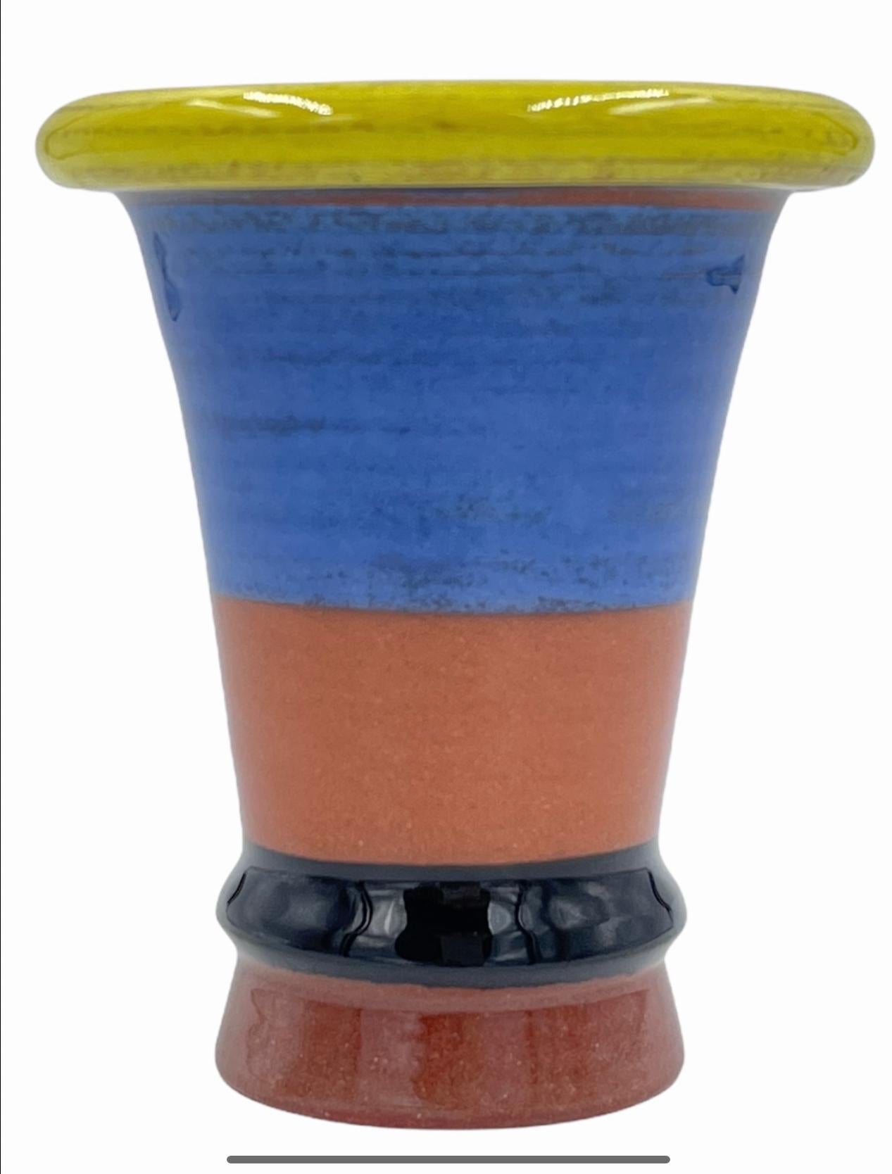 Expo vase 1997 in colors of yellow, blue, brick and black. Peter Shire, a founding member of Sottsass' Memphis Milano Group is an LA-based artist whose work eludes all attempts at categorization. He has created ceramics, furniture, toys, interior