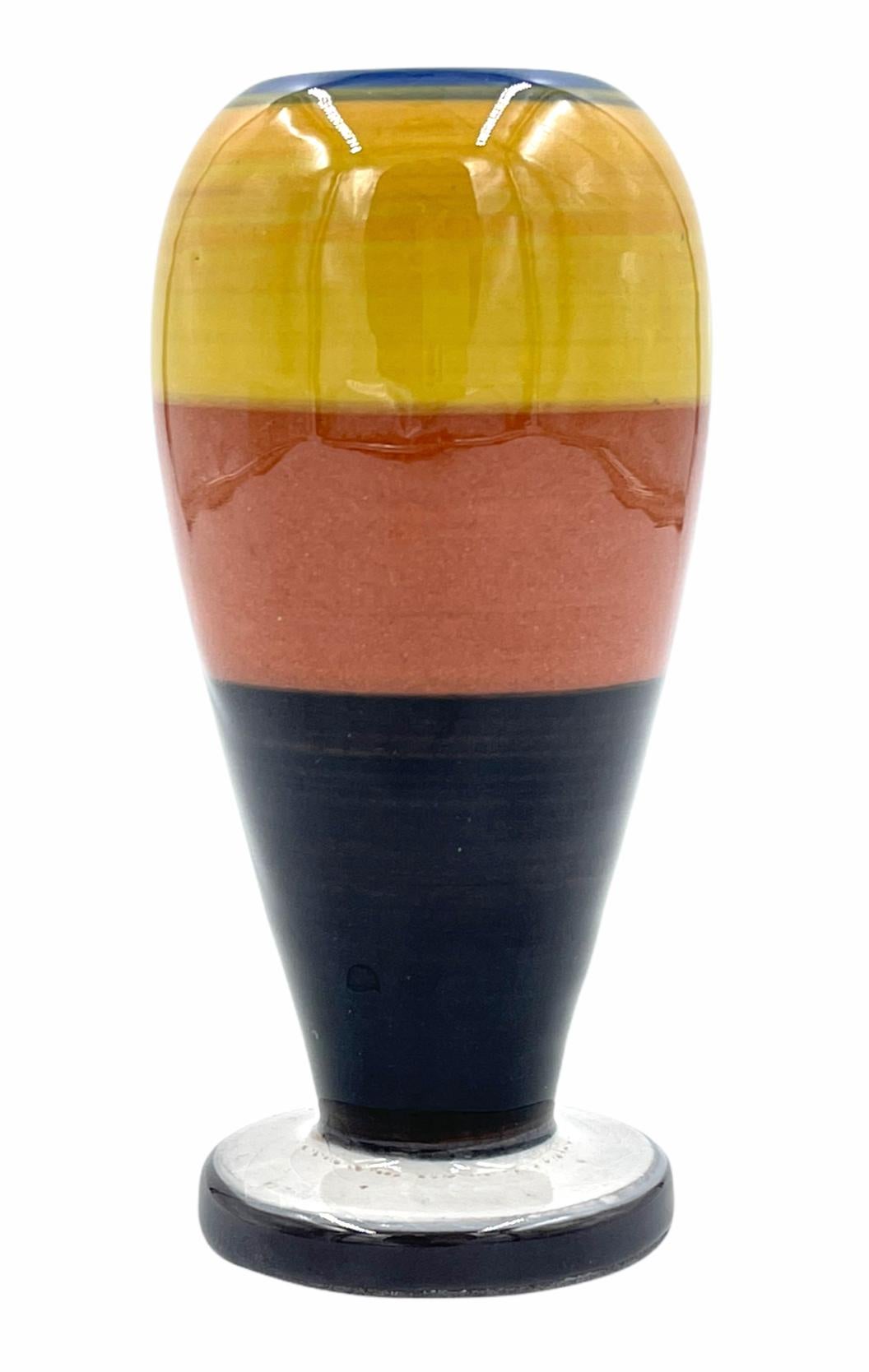 Expo vase 1997 in colors of yellow, brick and black. Peter Shire, a founding member of Sottsass' Memphis Milano Group is an LA-based artist whose work eludes all attempts at categorization. He has created ceramics, furniture, toys, interior designs