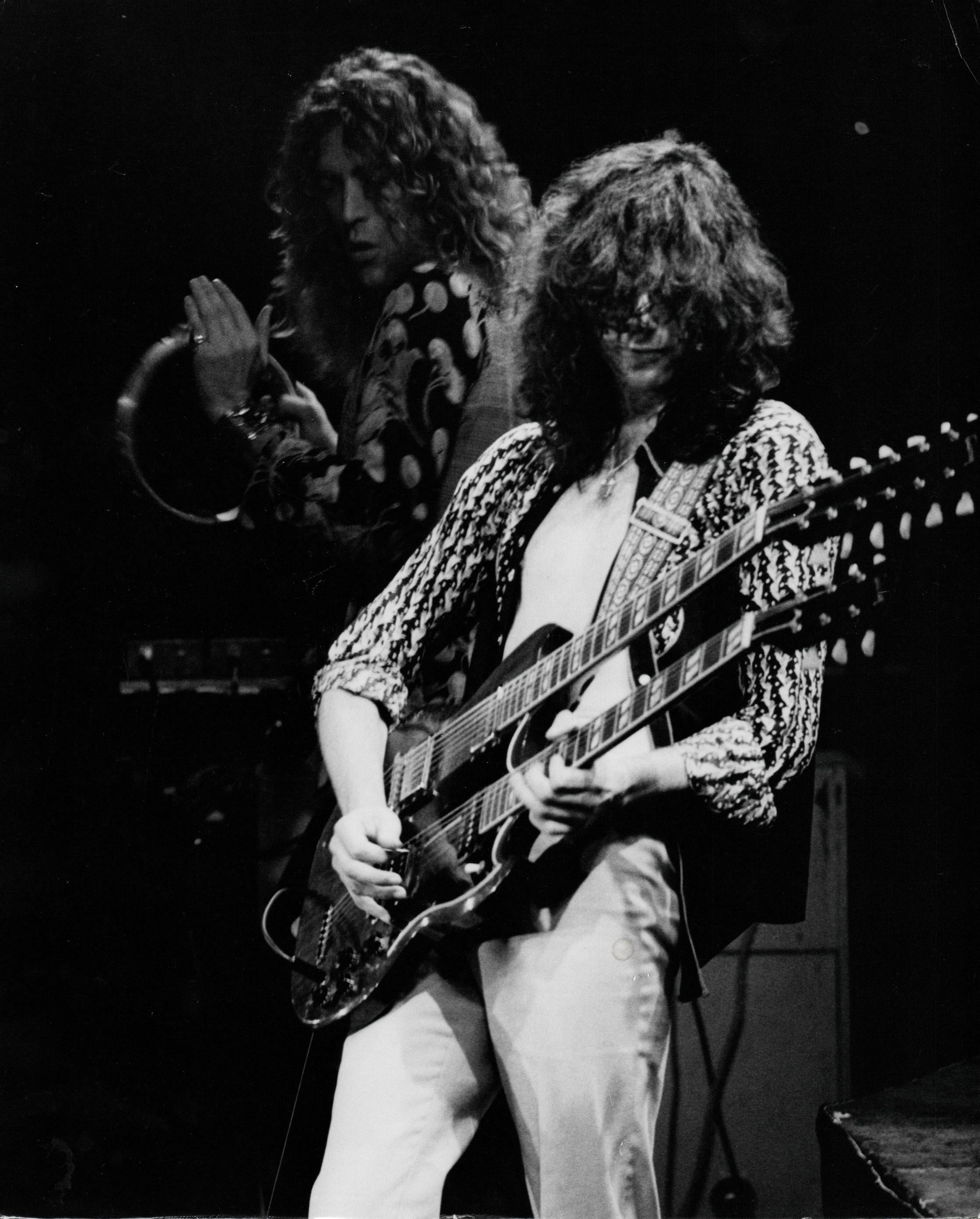 Peter Simon Portrait Photograph - Jimmy Page of Led Zeppelin Playing Double Guitar Vintage Original Photograph