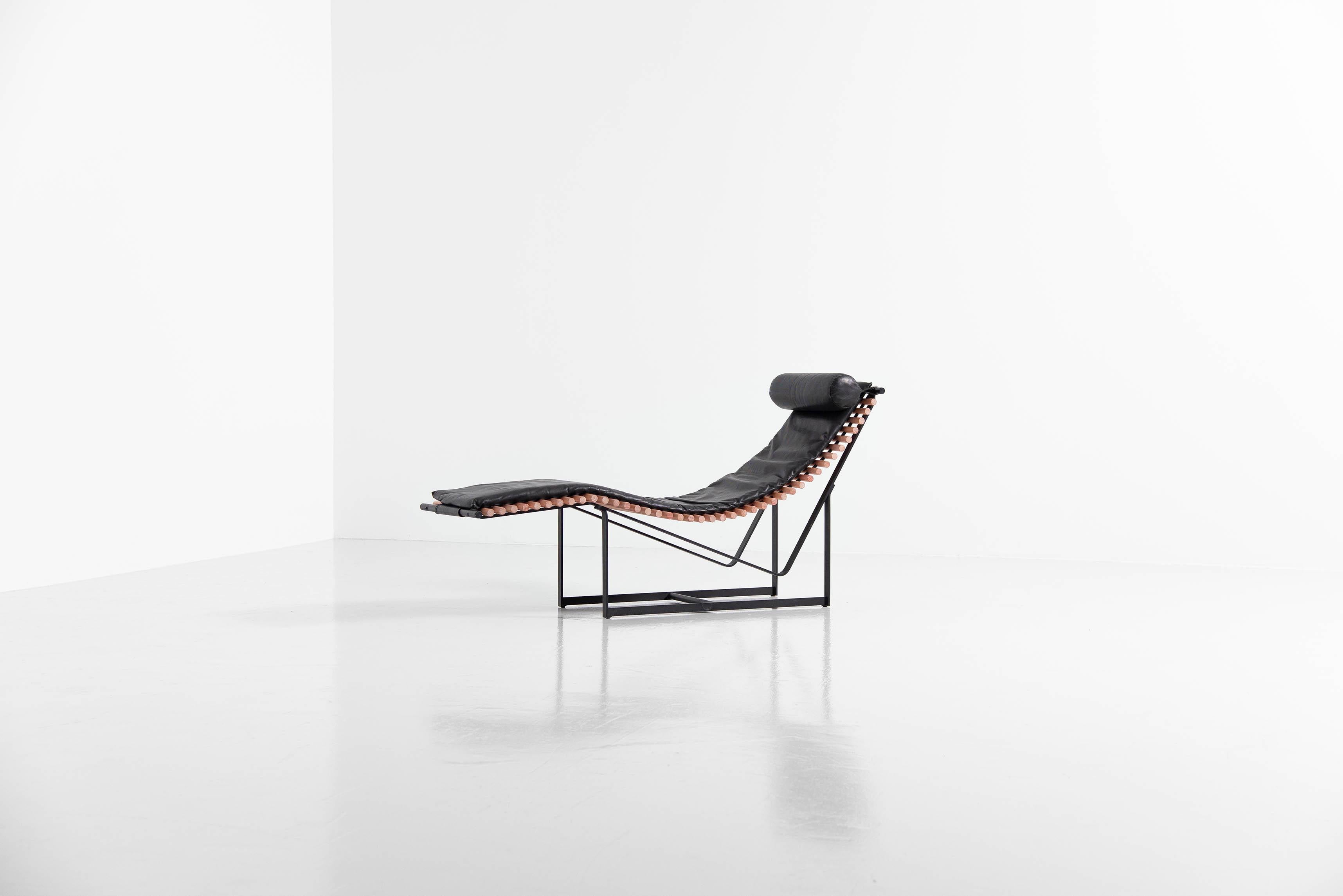 Stunning sculptural shaped lounge chair designed by Peter Strassl, Germany 1978. This super cool shaped lounge chair has solid beech wooden spines which create a skeleton like look. The wood spines create a beautiful shape with the black painted