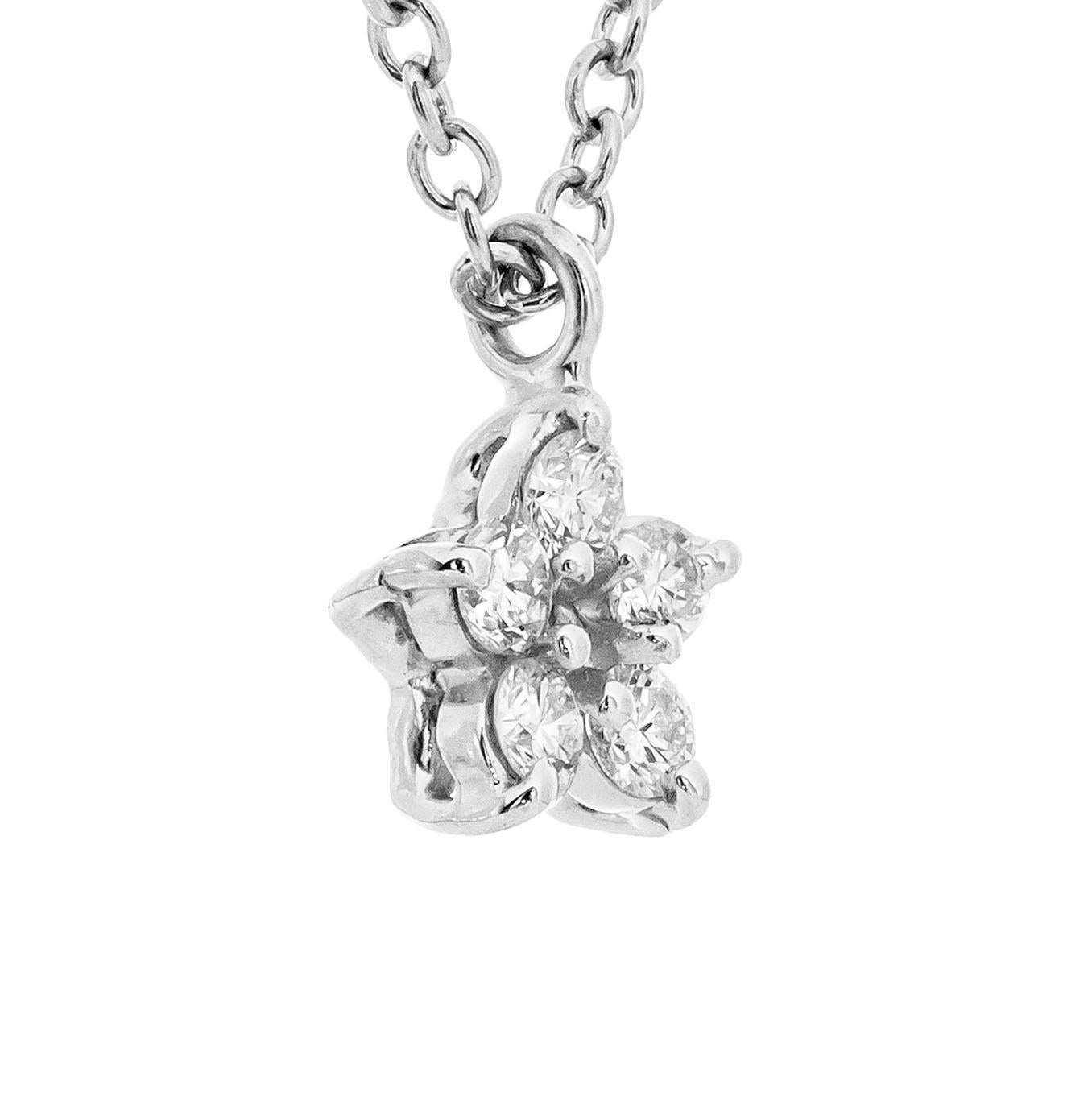 Petite star design pendant with 5 brilliant cut diamonds in platinum. 16 inch chain. Created in the Peter Suchy workshop.

5 round brilliant cut diamonds, F-G VS approx. .10cts
Platinum
Stamped: PT 950
2.6 grams
Top to bottom: 5.4mm or .20