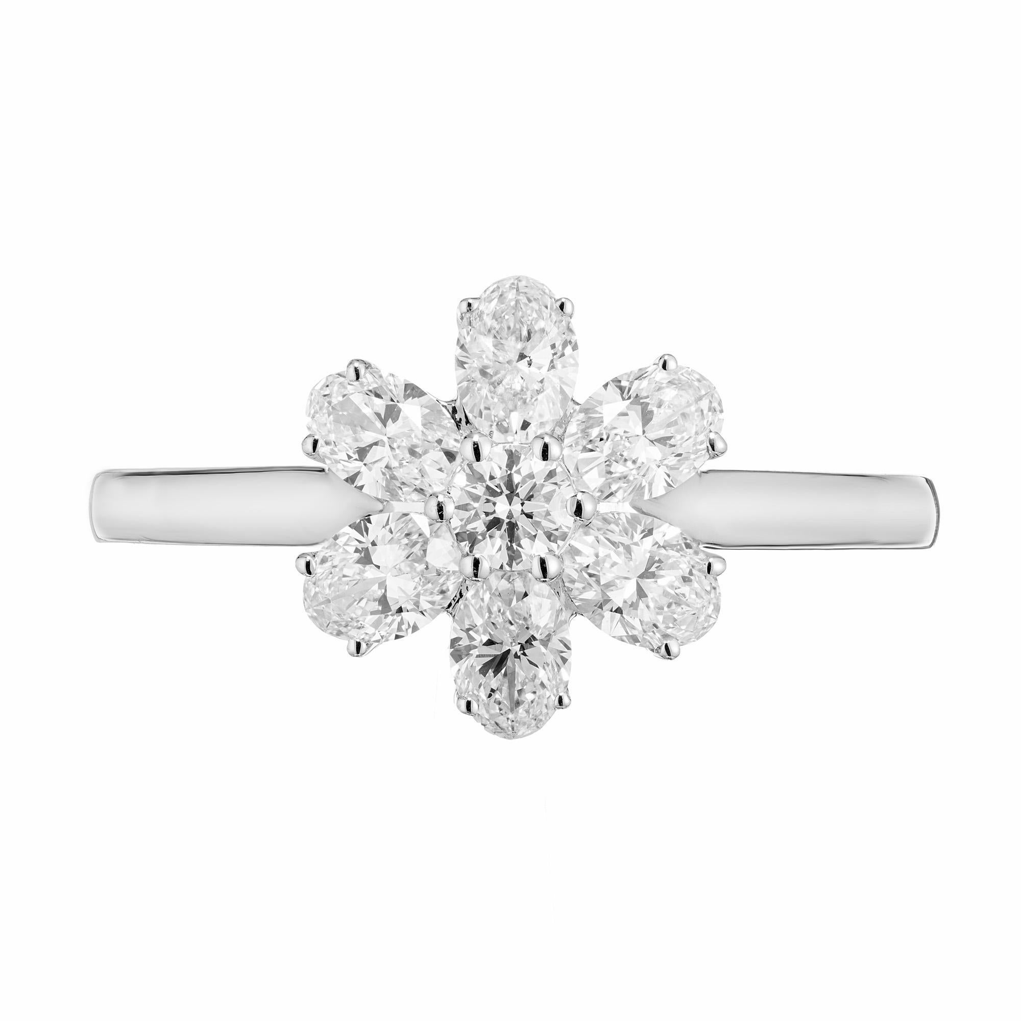 Six pointed diamond flower ring. 6 oval shape diamonds totaling .89cts with a single round brilliant cut diamond in the center. The flower style setting is 18k white gold and designed for these stones in the Peter Suchy Workshop. 

6 oval cut