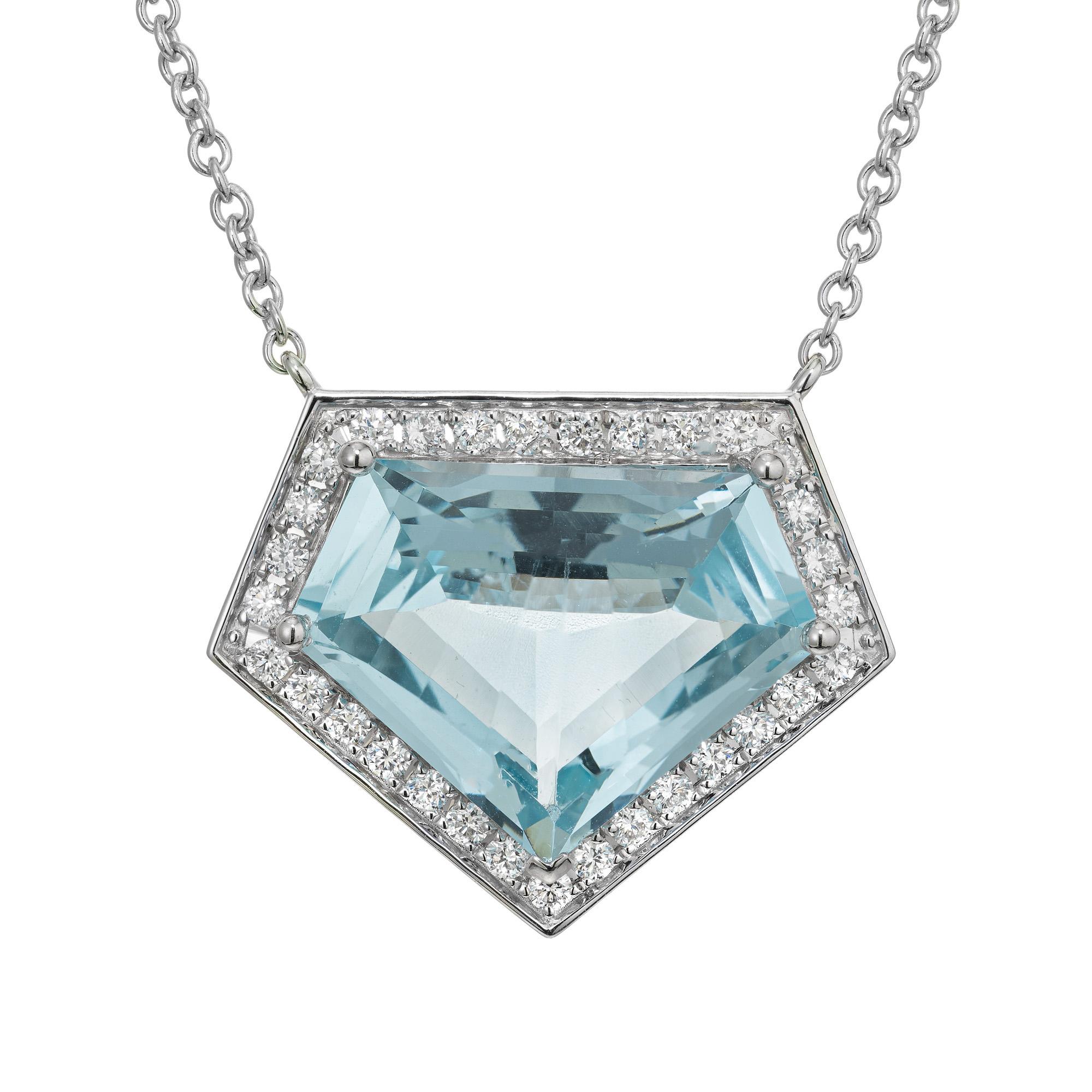 Unique, one of a kind, custom cut diamond shape aquamarine and diamond pendant necklace. This stunning piece begins with a 10.04ct aquamarine that is accented by a halo of 31 round brilliant cut diamonds. The icy blue hue of the aquamarine