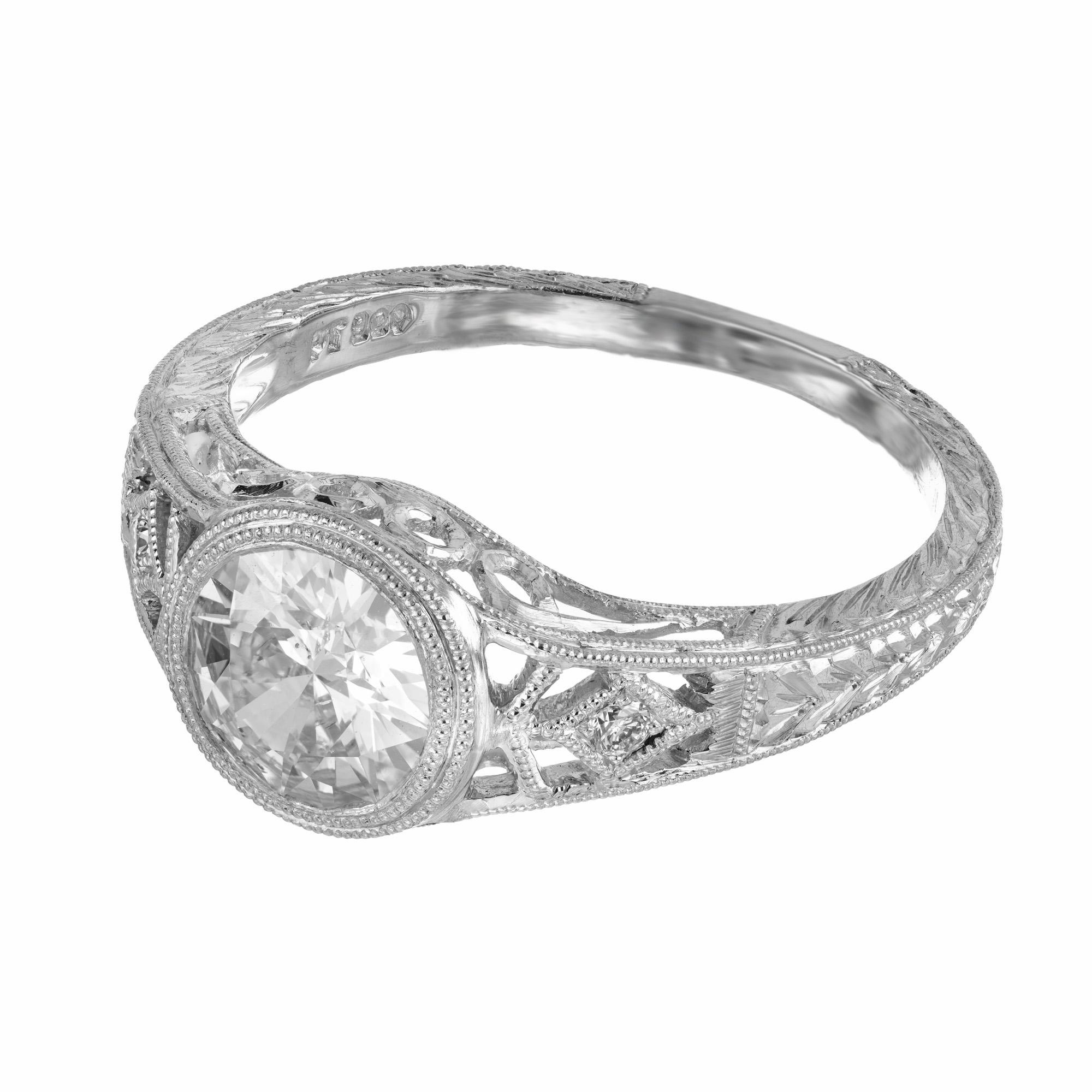 Beautiful GIA certified 1.01 carat old European diamond in an exceptionally crafted filigree platinum setting at a current size of 6.5. This wonderful old stone is accompanied by two other small stones that add just the needed sparkle to further