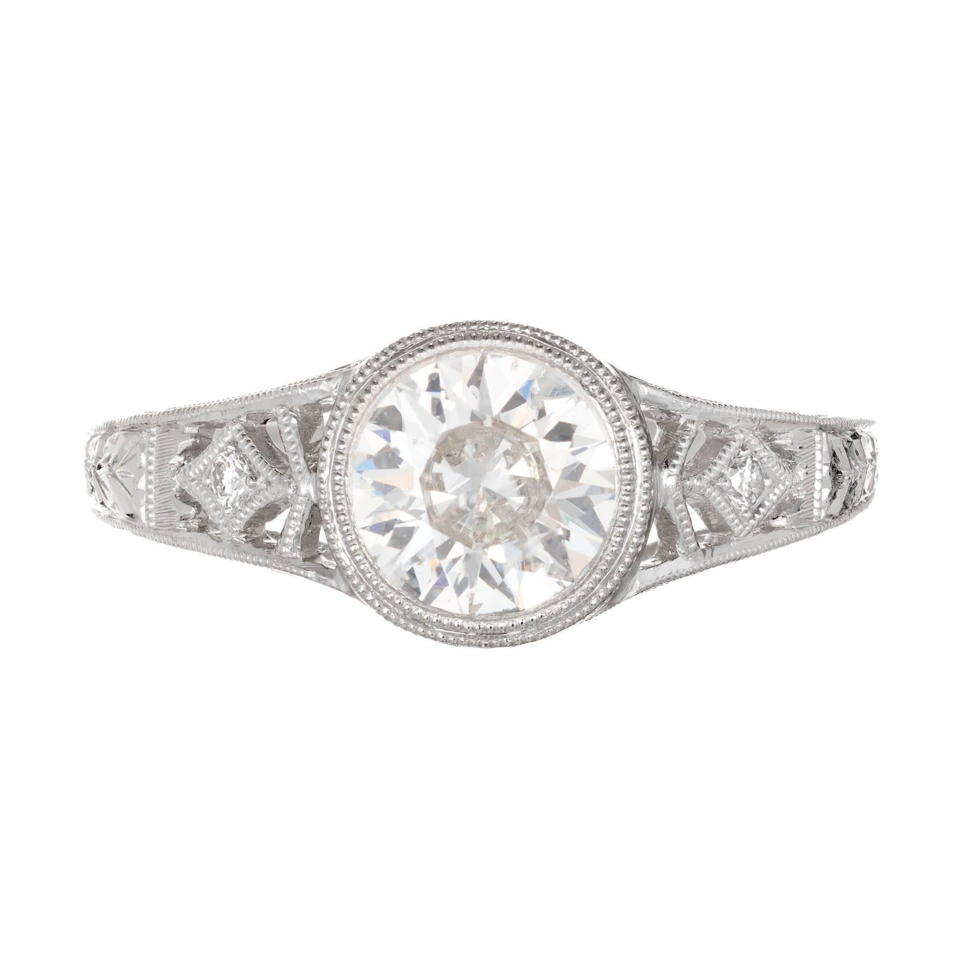 Old European round brilliant cut diamond engagement ring. Set in a filigree platinum setting. GIA certified.

1 old European diamond, approx. total weight 1.01cts, H, SI2, GIA certificate #2165523641
2 round diamonds, approx. total weight