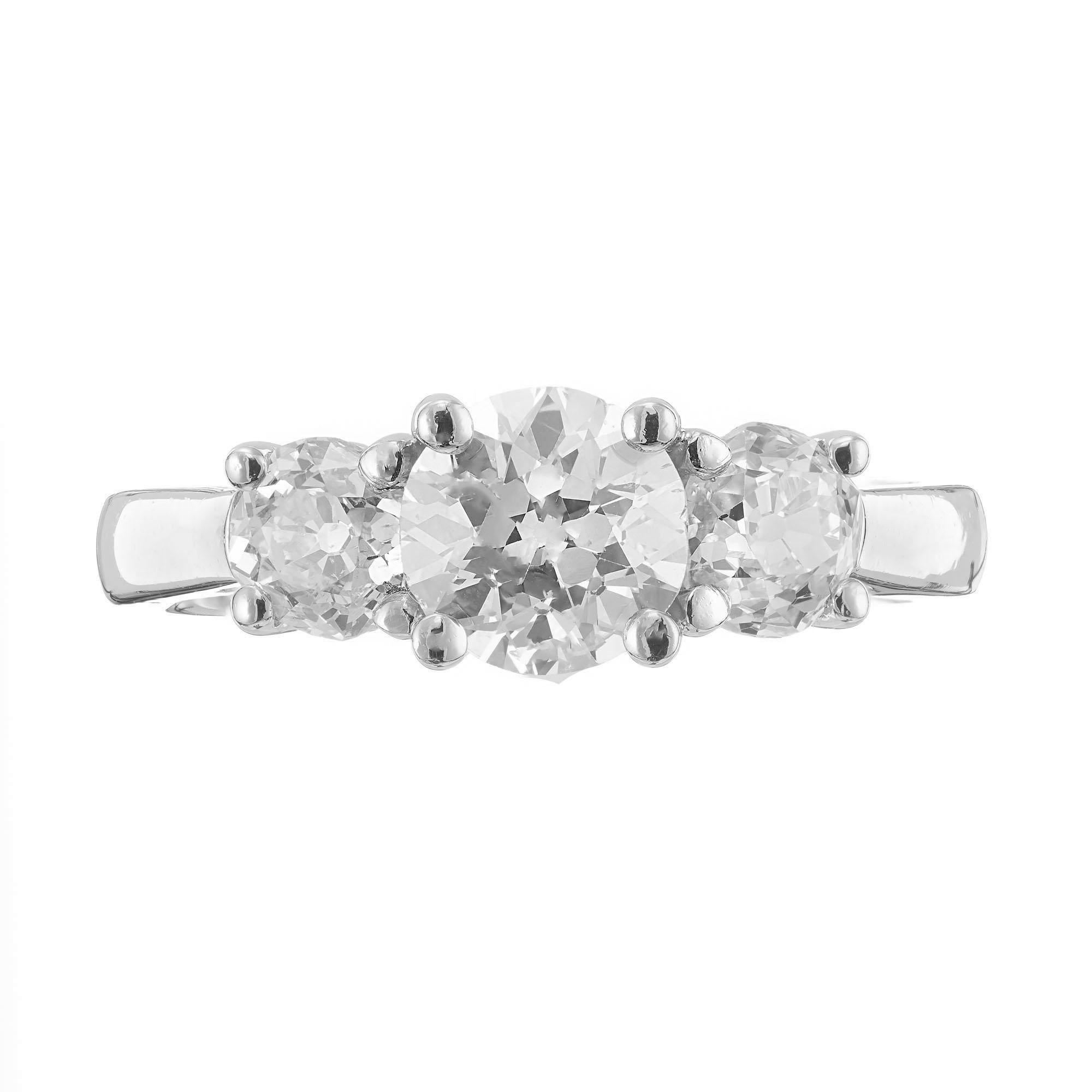 Three-stone diamond engagement ring. EGL certified Old European cut 1.01ct center stone, set in platinum with 2 Old European cut side diamonds. Created in the Peter Suchy Workshop. 

1 old European cut diamond 1.01ct, E, SI3.  EGL certificate# NA