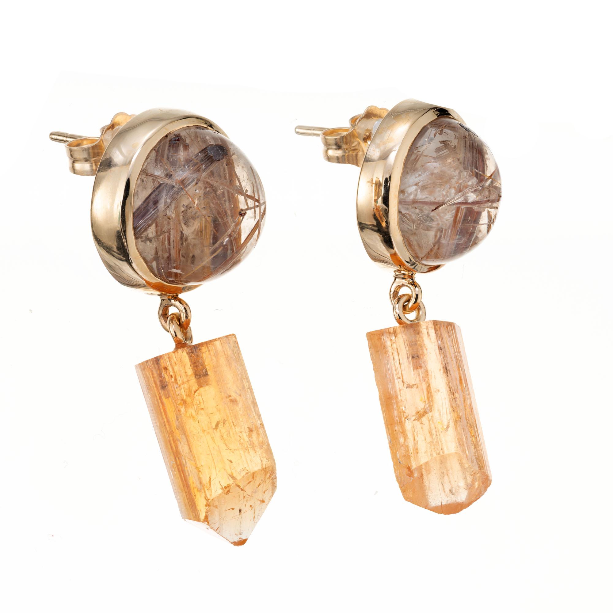 Handmade 14k yellow gold dangle earrings with cabochon rutilated quartz tops and natural precious orange topaz crystal dangles. Designed and crafted in the Peter Suchy workshop

2 rutilated clear golden cabochon quartz, IMP approx. 10.21cts
2 orange