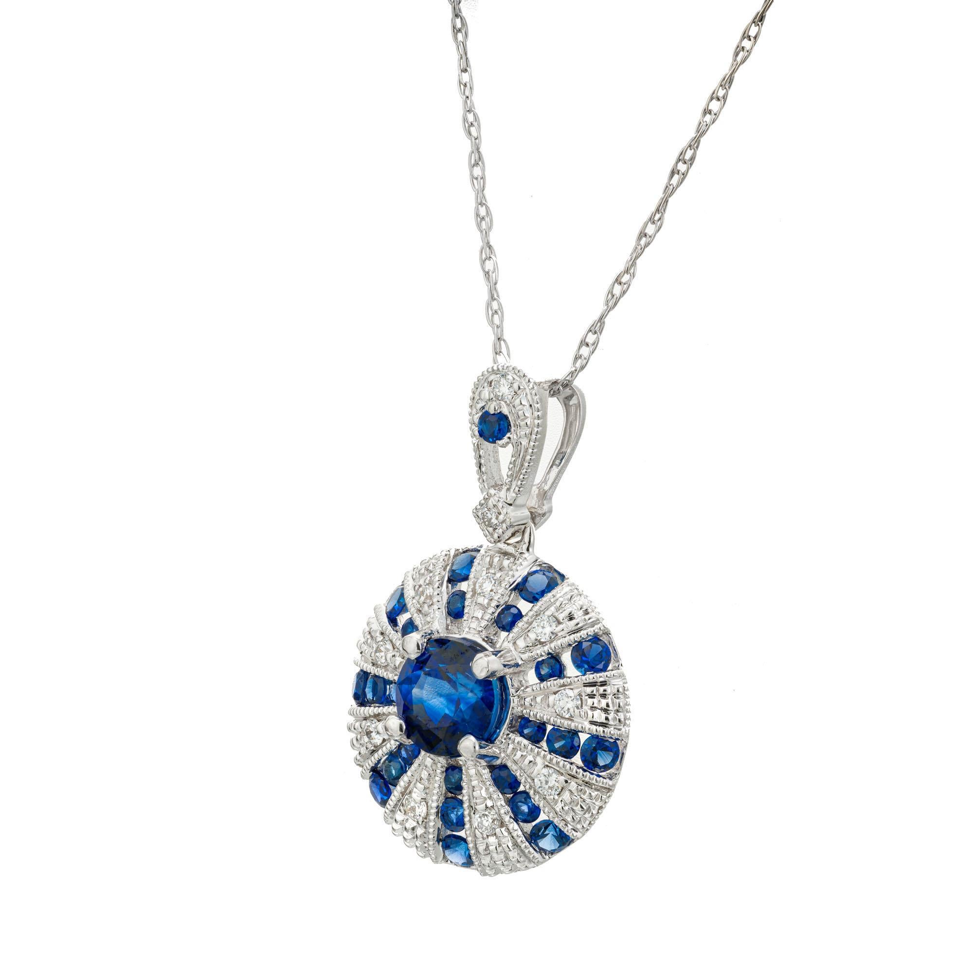 Sapphire and diamond pendant necklace. Art Deco style pendant with round blue sapphires and round brilliant cut diamonds set in 14k white gold. 18 inch white gold chain. Designed and crafted in the Peter Suchy workshop

1 round blue sapphire,