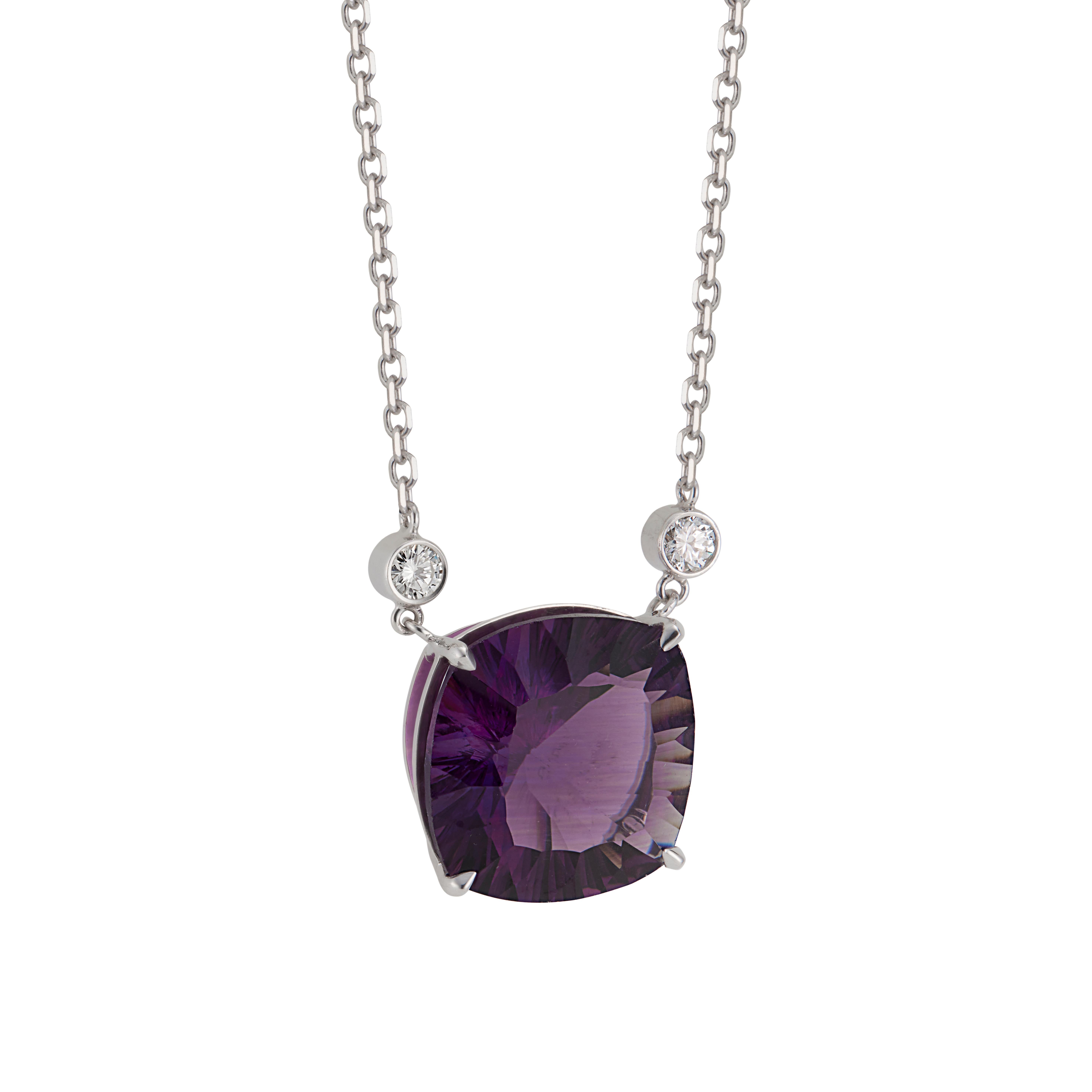 Amethyst and diamond pendant necklace. 10.51ct Natural untreated cushion cut amethyst, set in 14k white gold setting with 2 round brilliant cut accent diamonds. Designed and crafted in the Peter Suchy Workshop. 19 inch 14k white gold chain. 

1