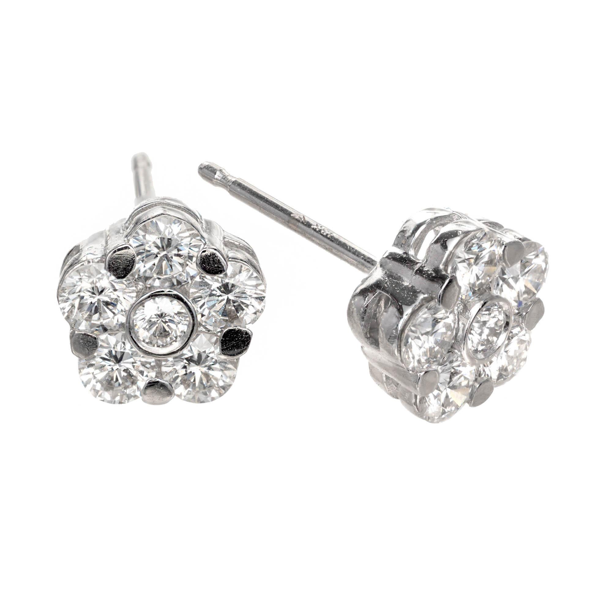 Peter Suchy 1.06ct diamond 18k white gold cluster stud earrings 

12 round brilliant cut F-G VS diamonds, Approx. 1.06 carat 
18k White Gold 
Stamped: 18k
2.0 Grams
Top to Bottom: 7.1mm or .28 Inches
Width: 7.1mm .28 Inches
Depth or Thickness: 3.5mm