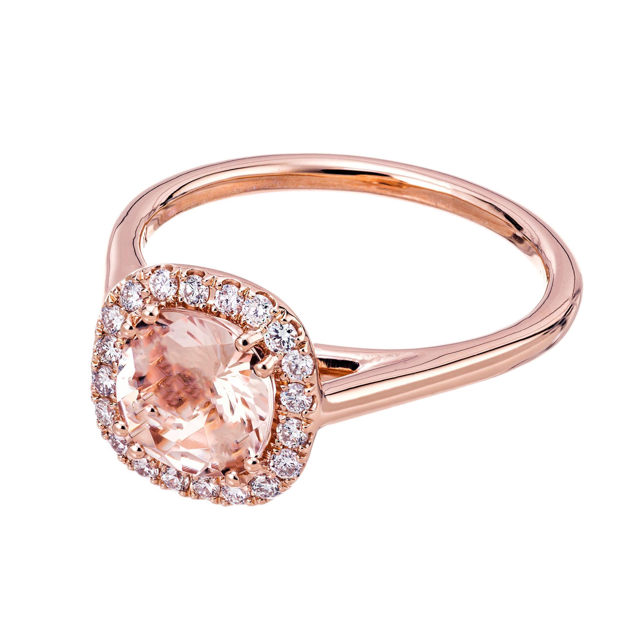 Morganite and diamond halo engagement ring. 1.08cts cushion cut morganite center stone with a halo of 20 round brilliant cut diamonds set in 14k rose gold . Designed and crafted in the Peter Suchy workshop.

1 cushion shaped orangey pink morganite,