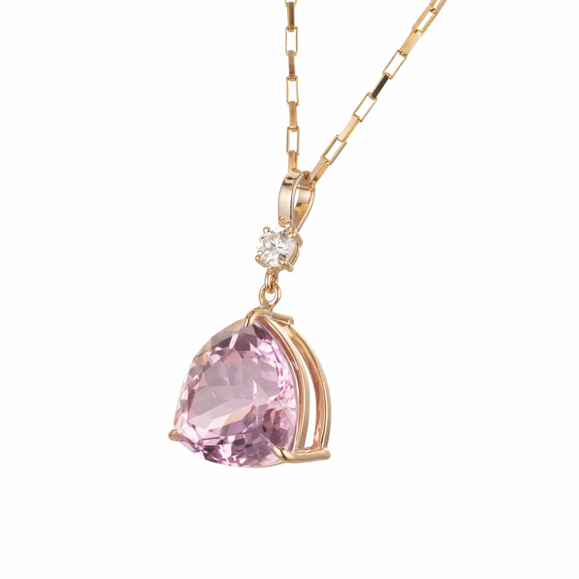 Peter Suchy 10.96 carat bright pink kunzite with a round brilliant cut diamond accent on a 18 inch yellow gold chain. Designed and crafted in the Peter Suchy Workshop. 

1 triangular cushion pink VS Kunzite, Approximate 10.96ct 
1 round brilliant