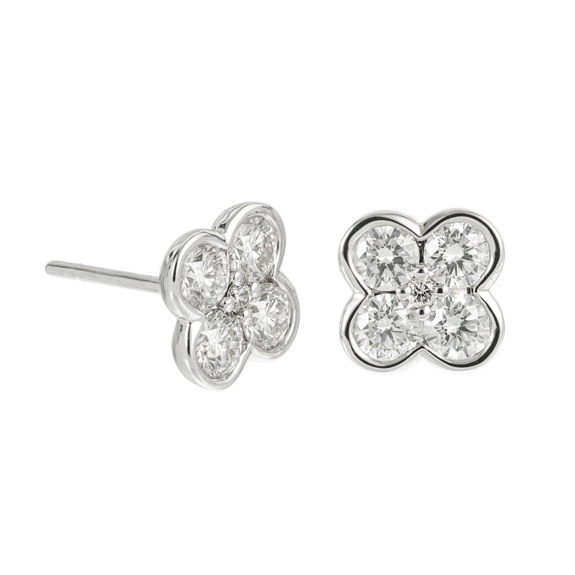 Diamond flower petal earrings in white gold. 10 round brilliant cut diamonds approx. 1.10 ts. Designed and crafted in the Peter Suchy workshop.

10 round brilliant cut diamonds, F-G SI approx. 1.10cts 
14k white gold 
Stamped: 585
2.2 grams
Top to