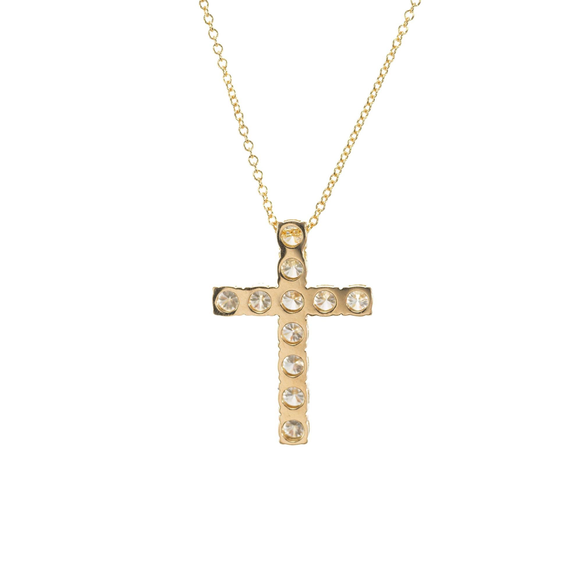 Peter Suchy custom made 18k yellow gold 1.15 carat round brilliant cut diamond cross. 18k Yellow gold.  18 inch chain. 

11 round brilliant cut diamonds F-G VS, approx. 1.15cts
18k yellow gold 
Stamped: 18k ITALY 
3.5 grams
Top to bottom: 22.15mm or