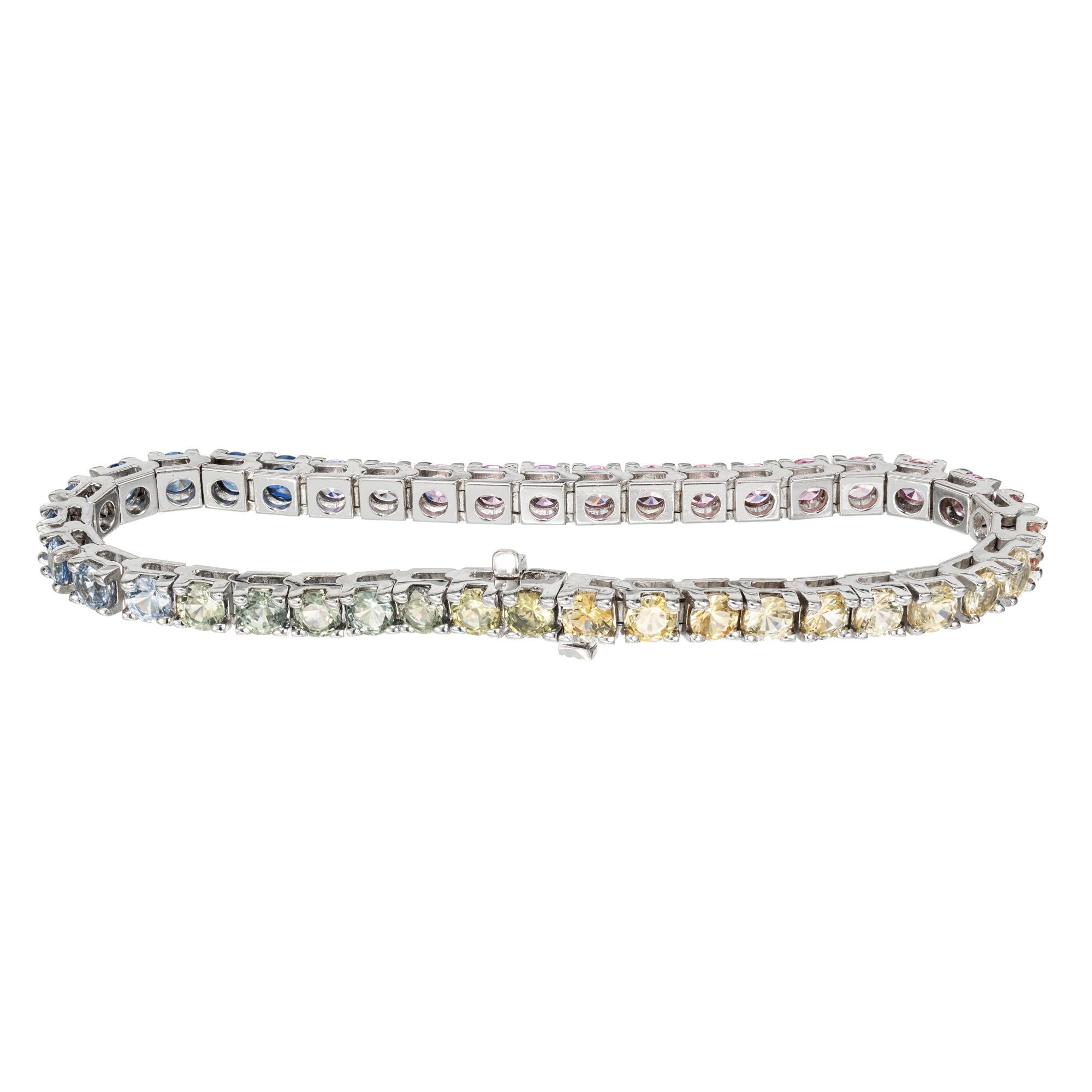 Multi-color genuine Sapphire hinged link tennis bracelet. 40 multicolor sapphires- blended blue, yellow, pink and green Sapphires set in 14k white gold. Created in the Peter Suchy Workshop. Built in catch and underside safety. 7.25 inches. 

40