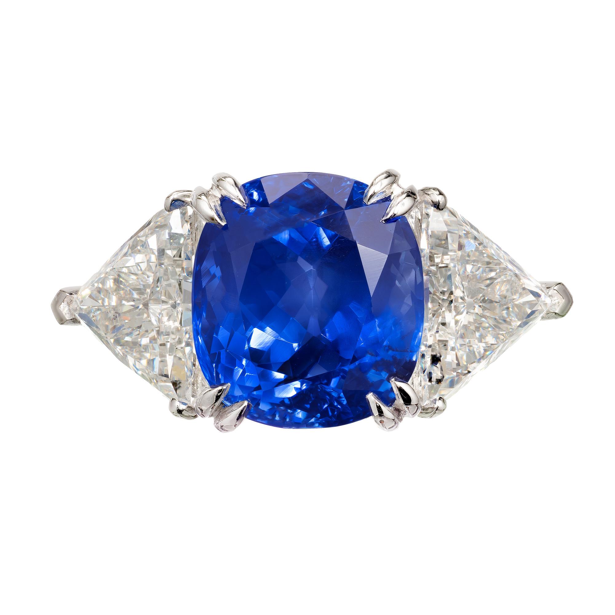 Sapphire and diamond three-stone engagement ring. Original natural GIA certified no heat cushion cut Sri Lanka Ceylon fine bright blue 9.44ct Sapphire Well-polished center stone. Matched with 2 triangular brilliant cut diamonds also GIA certified in