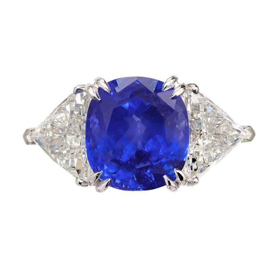 Designed to captivate, the Peter Suchy GIA certified 12.52 Carat sapphire and diamond platinum engagement ring is a masterpiece of elegance and elegance. This stunning three-stone platinum setting begins with a mesmerizing 12.52 carat sapphire,