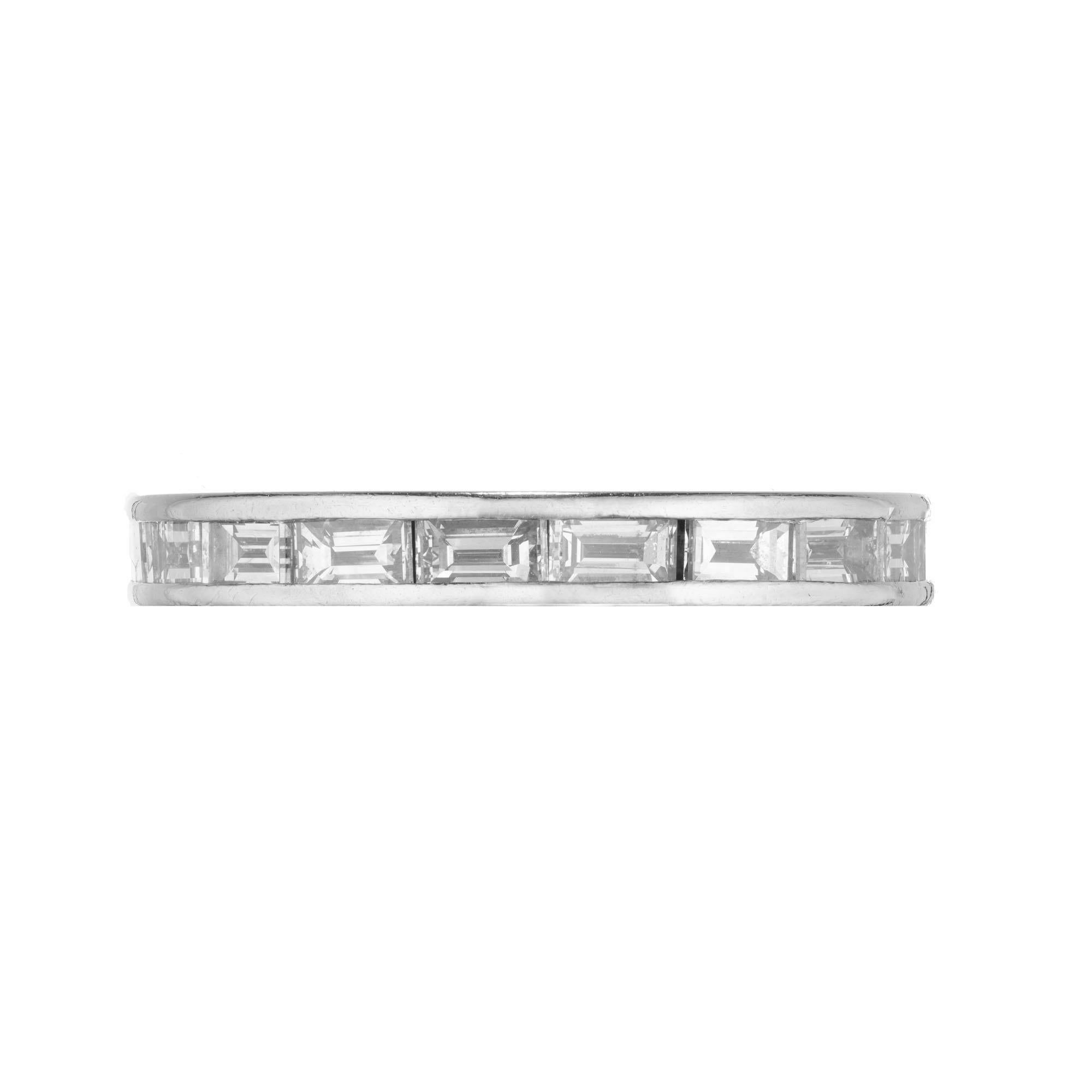  1.30 carats of channel set baguette diamonds in and eternity band wedding ring. Crafted in the Peter Suchy Workshop. 

19 straight cut baguette diamonds G-H VS, approx. 1.30cts
Size 6
Platinum 
Stamped: PL 
3.4 grams 
Width at top: 2.97mm
Height at