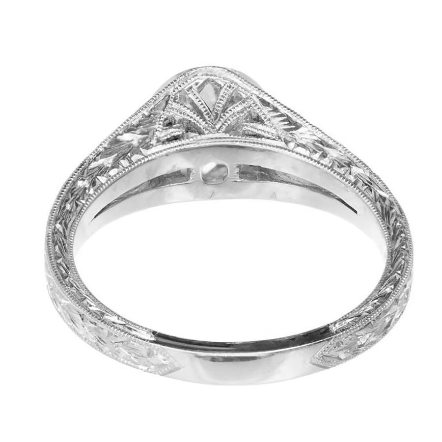 EGL Certified, 1.32 Carat Diamond Split Shank Platinum Engagement Ring. Hand engraved sides and shoulders with diamonds along each side of the split shank. Handmade milgrain bezel, for the center stone. The ring was designed and crafted in the Peter