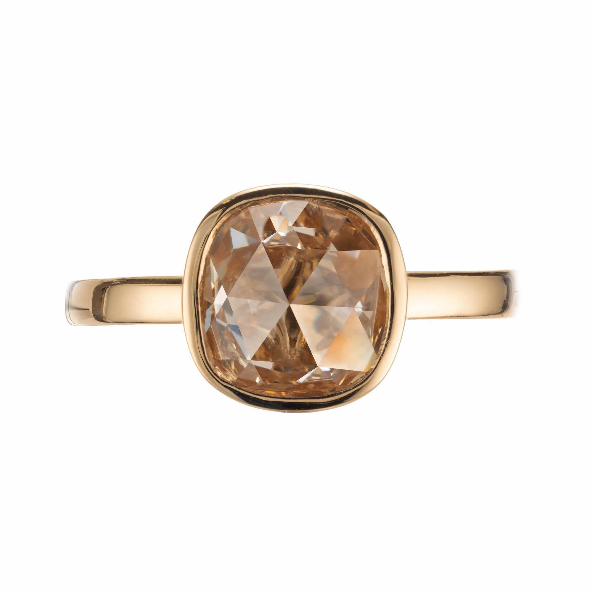 Natural light brown cushion shape rose cut diamond set in a simple bezel solitaire style 18k yellow gold engagement ring, crafted in the Peter Suchy Workshop.

1 cushion shape rose cut light brown U-V SI2 diamond, Approximate 1.35 carats. GIA