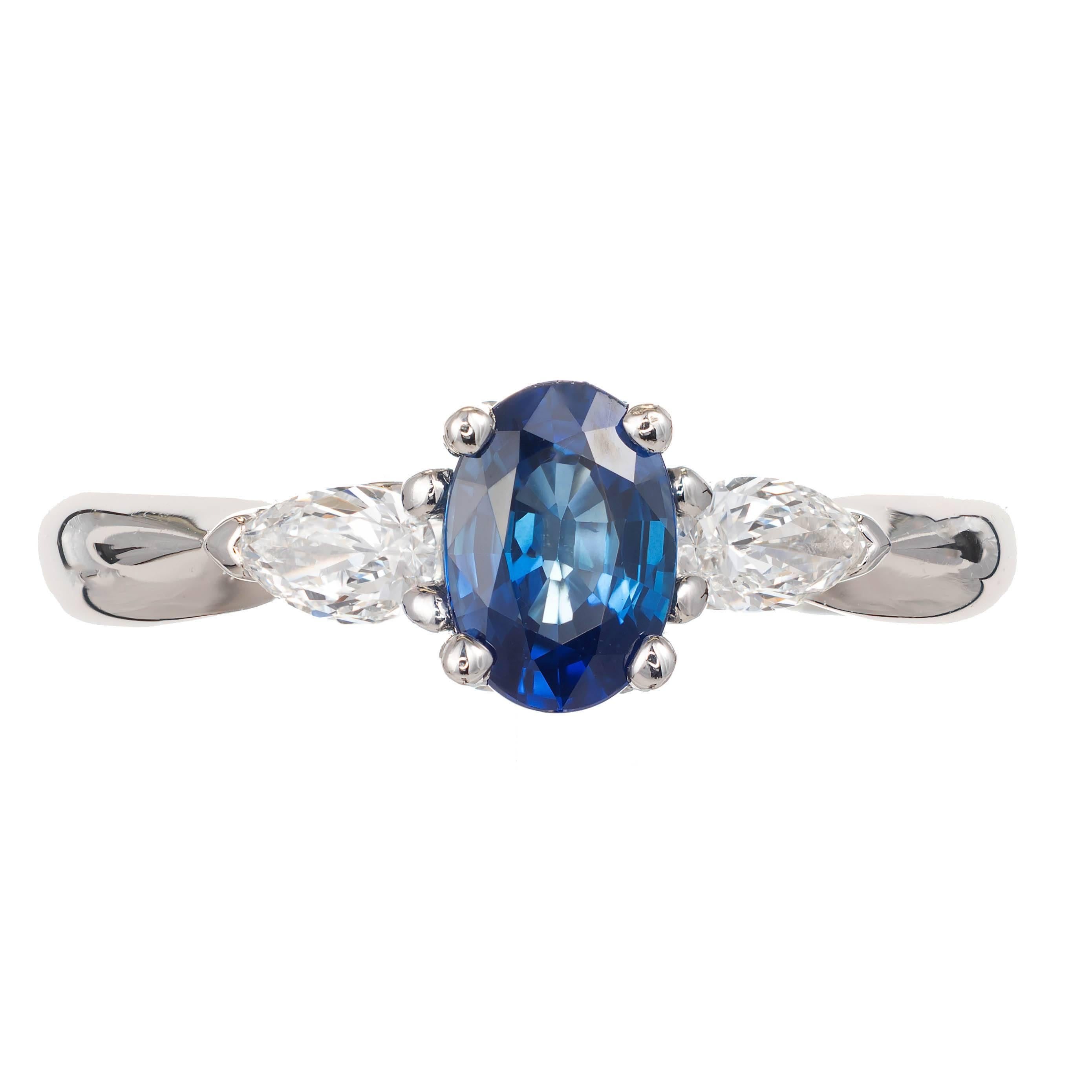Oval sapphire and diamond pear three-stone engagement ring. Platinum setting made in the Peter Suchy workshop

1 Oval blue heated sapphire 7.10 x 5.02 x3.4 approximate 1.00 carats
2 pear cut diamonds H-I VS-SI approximate .36 carats
Size 7 and