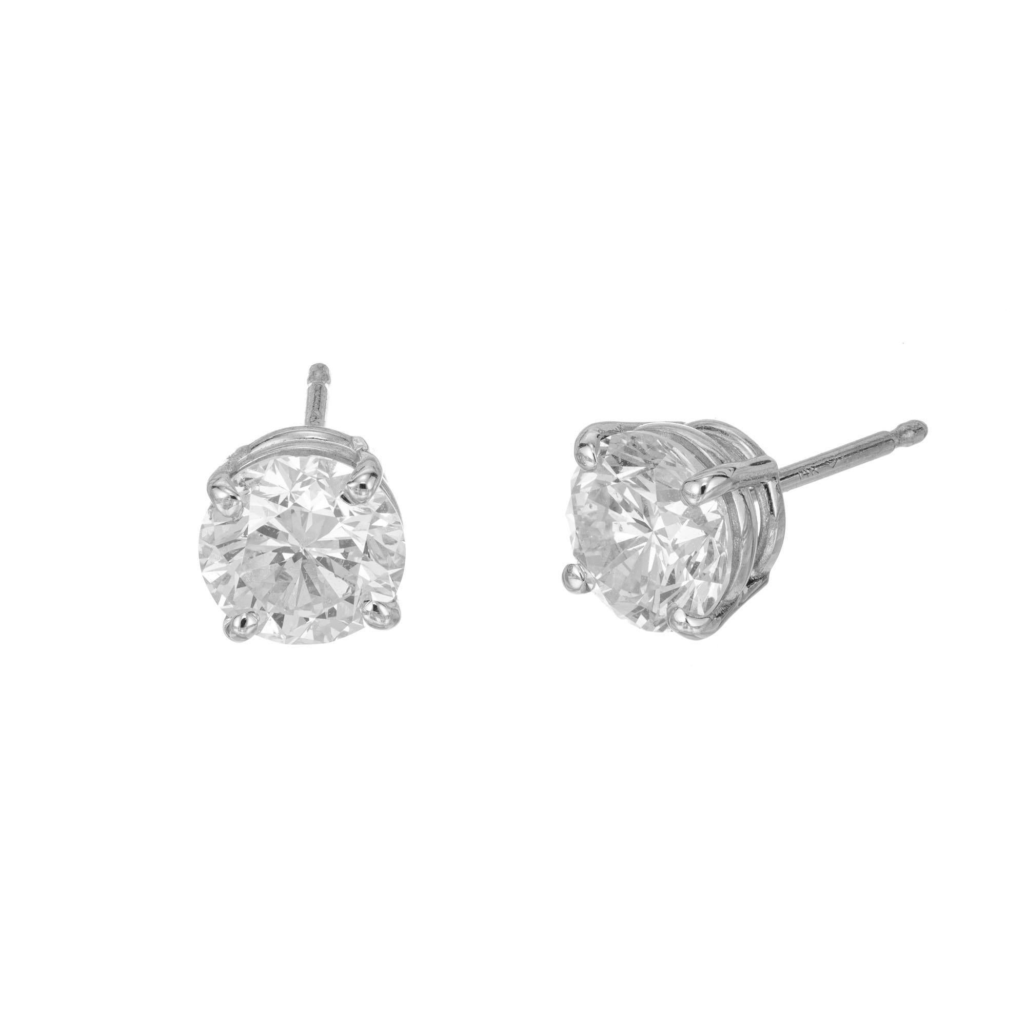 Peter Suchy Brilliant cut diamond platinum stud earrings. 2 EGL certified diamonds in platinum baskets. Created in the Peter Suchy Workshop. 

1 round brilliant cut diamond, G-H SI2 approx. .70cts EGL Certificate # EGL400148925D
1 round brilliant
