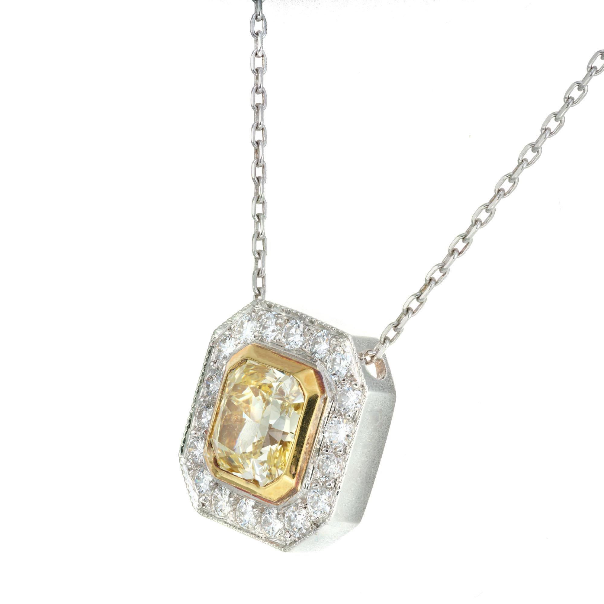 Yellow diamond halo pendant necklace. 1.50ct Fancy yellow radiant cut EGL certified center diamond with a halo of 18 round diamonds in a handmade platinum and 18k yellow gold setting from the Peter Suchy Workshop. Pendant slides on chain. 16 inch