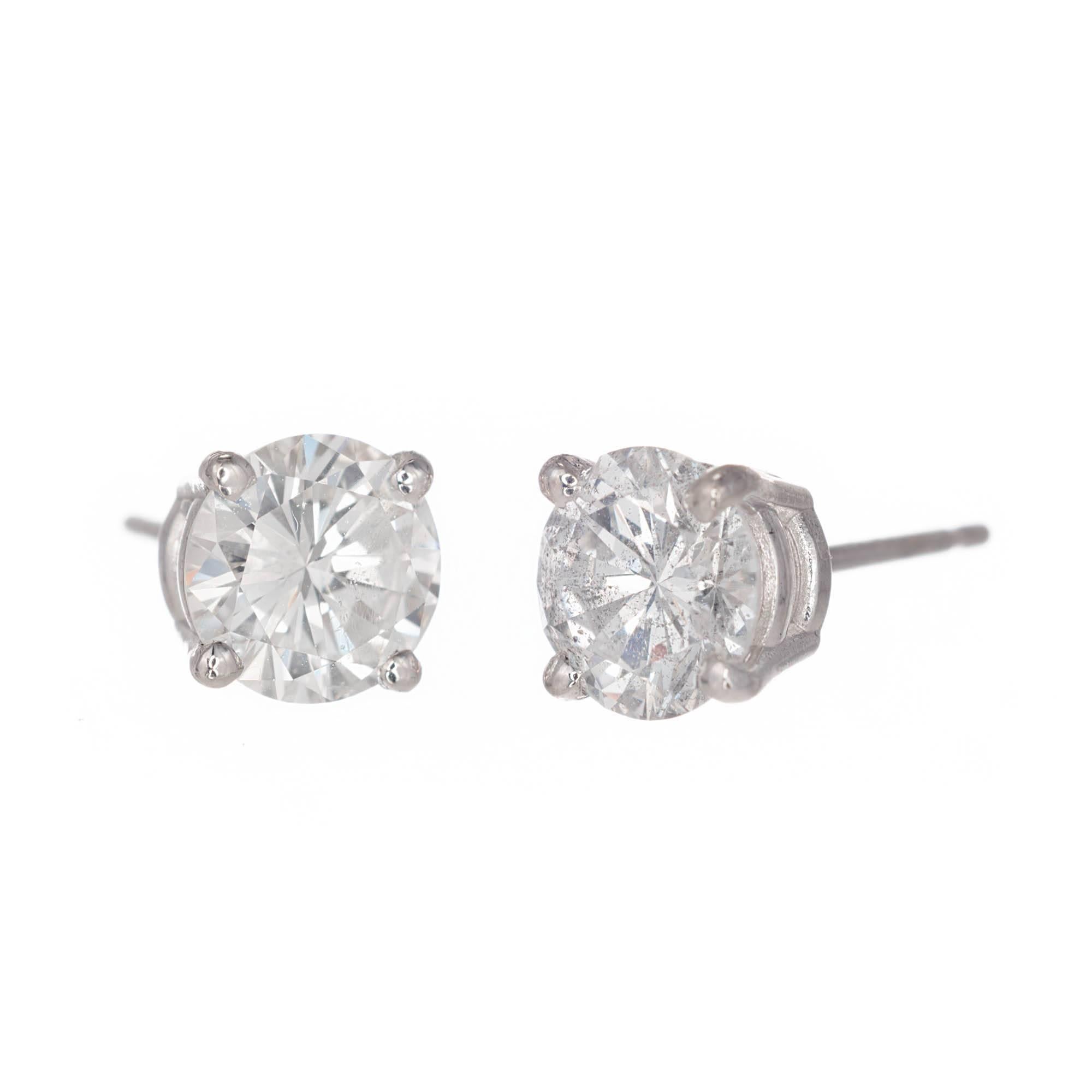 Round brilliant cut diamond stud earrings set in a 14k white gold four prong setting. EGL certified.

1 round diamond H-I I 5.9-5.86 x 3.50 approximate .72 carats. EGL Certificate # US 314545202J
1 round diamond F-G I 5.89-5.87-3.50mm approximate