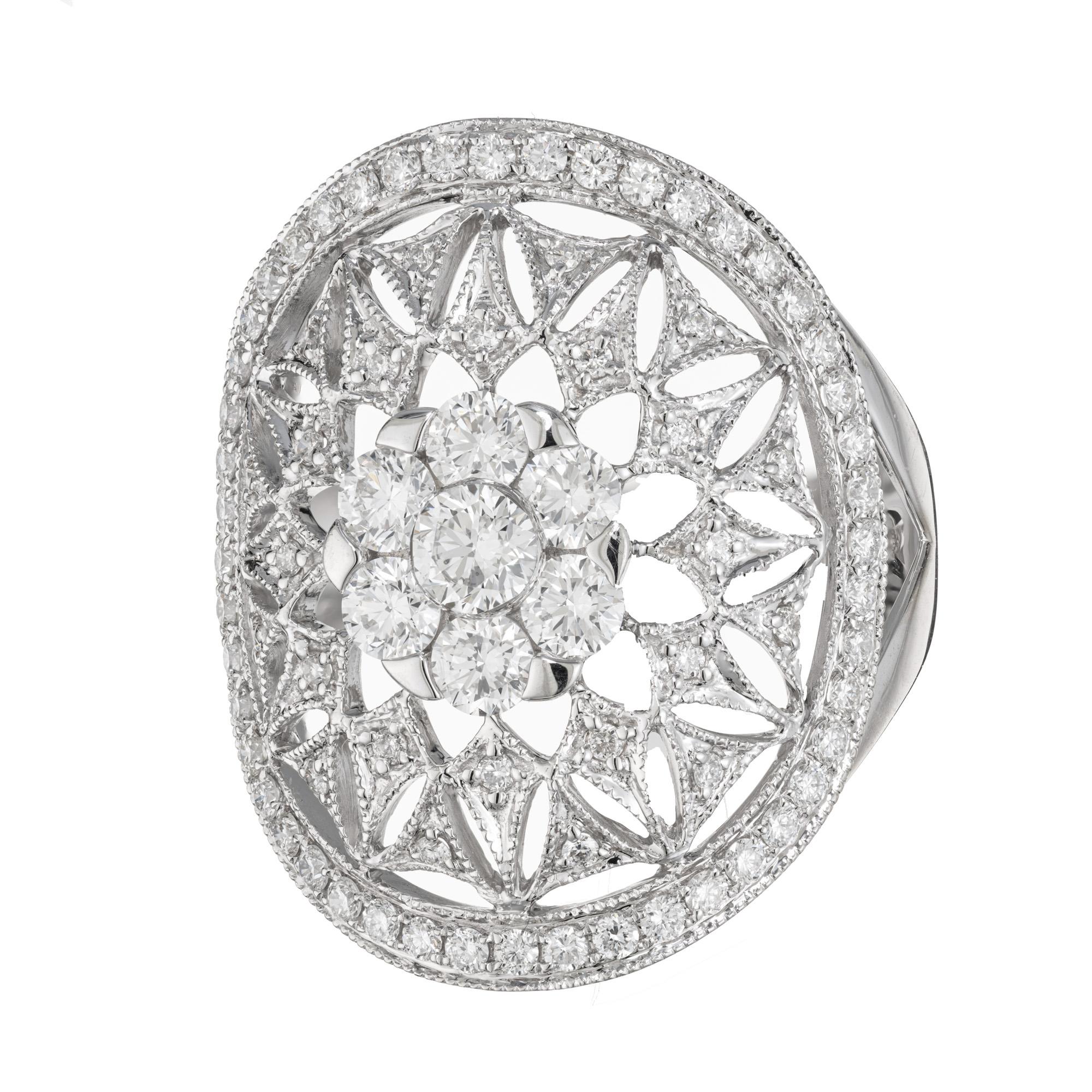 Spectacular diamond dome large cocktail ring. This ring boats 79 round brilliant cut diamonds of all different sizes. The largest one being in a center cluster with a halo of 6 round diamonds. Connected to the cluster is a pattern of interconnected