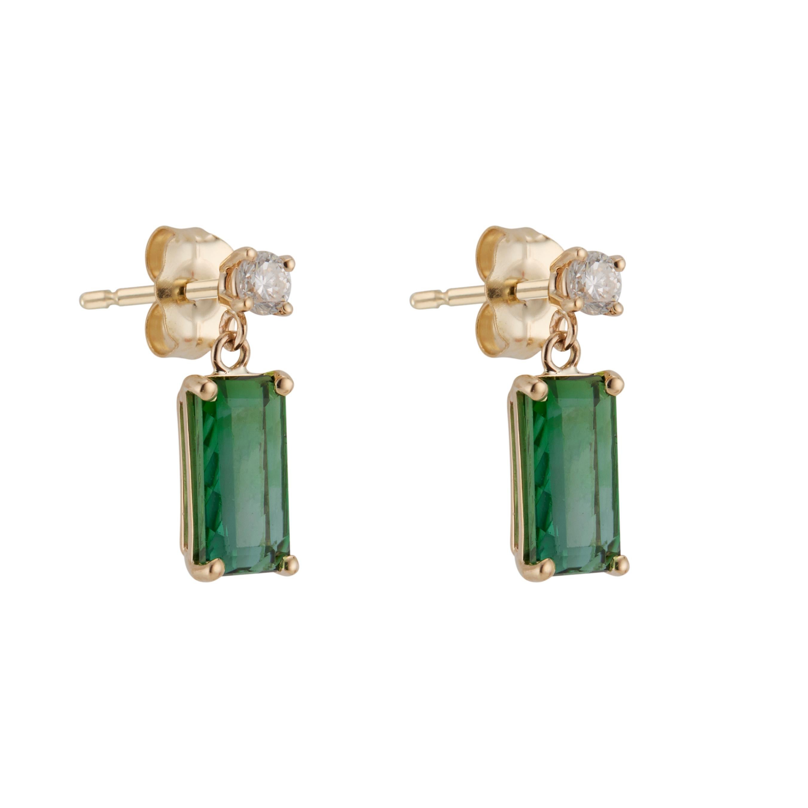Tourmaline and diamond dangle earrings. Custom cut rectangular green tourmalines dangles, with 2 round brilliant cut top diamonds set in 14k yellow bold baskets from the Peter Suchy workshop.

2 rectangular green quilt cut bottom tourmalines, VS