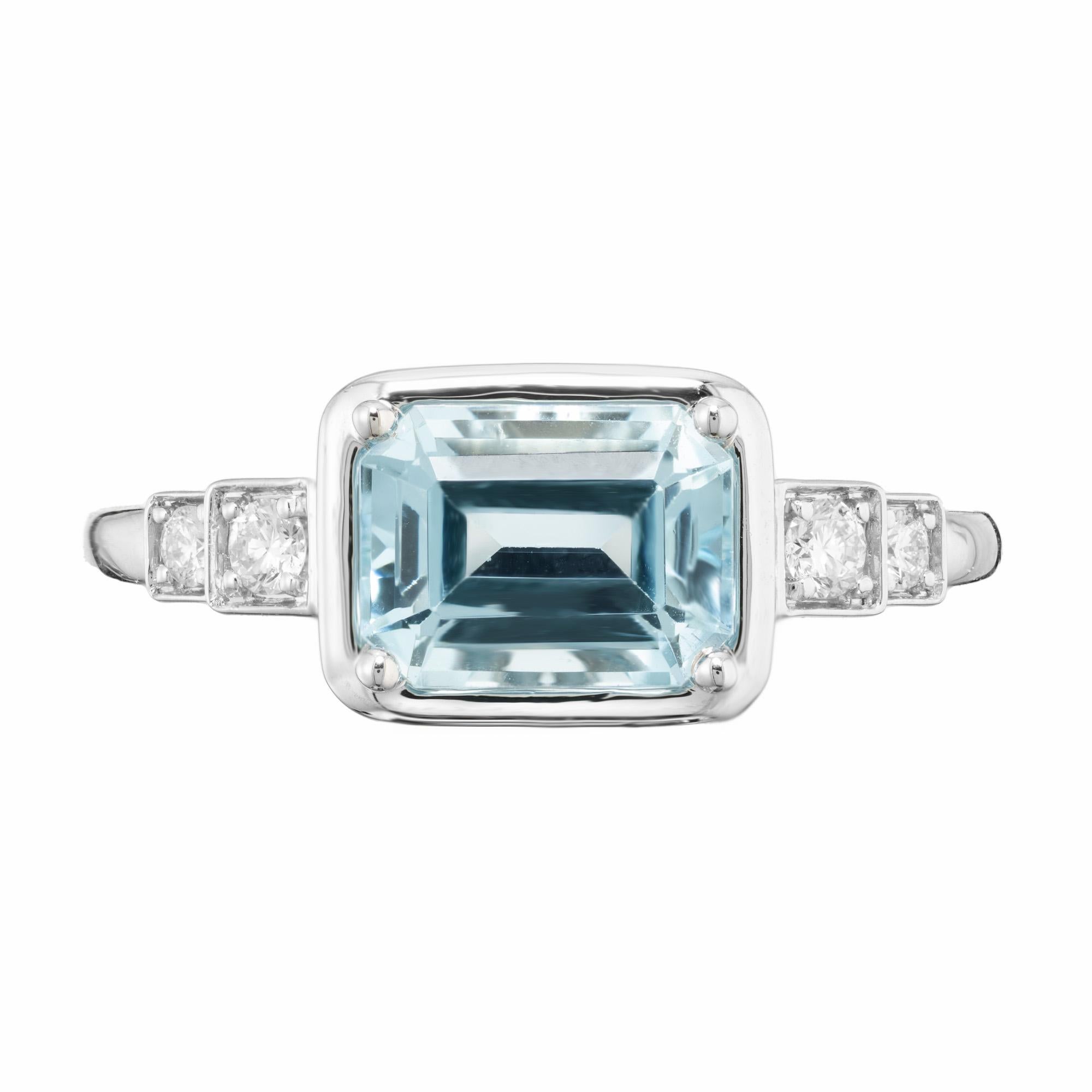 Very bright 1.52 carat rectangular cut aqua and diamond 18k white gold custom original designed engagement ring.  The center aqua is taken from a 1920s estate and is east to west set, accented by 4 round brilliant cut diamonds. This ring exudes
