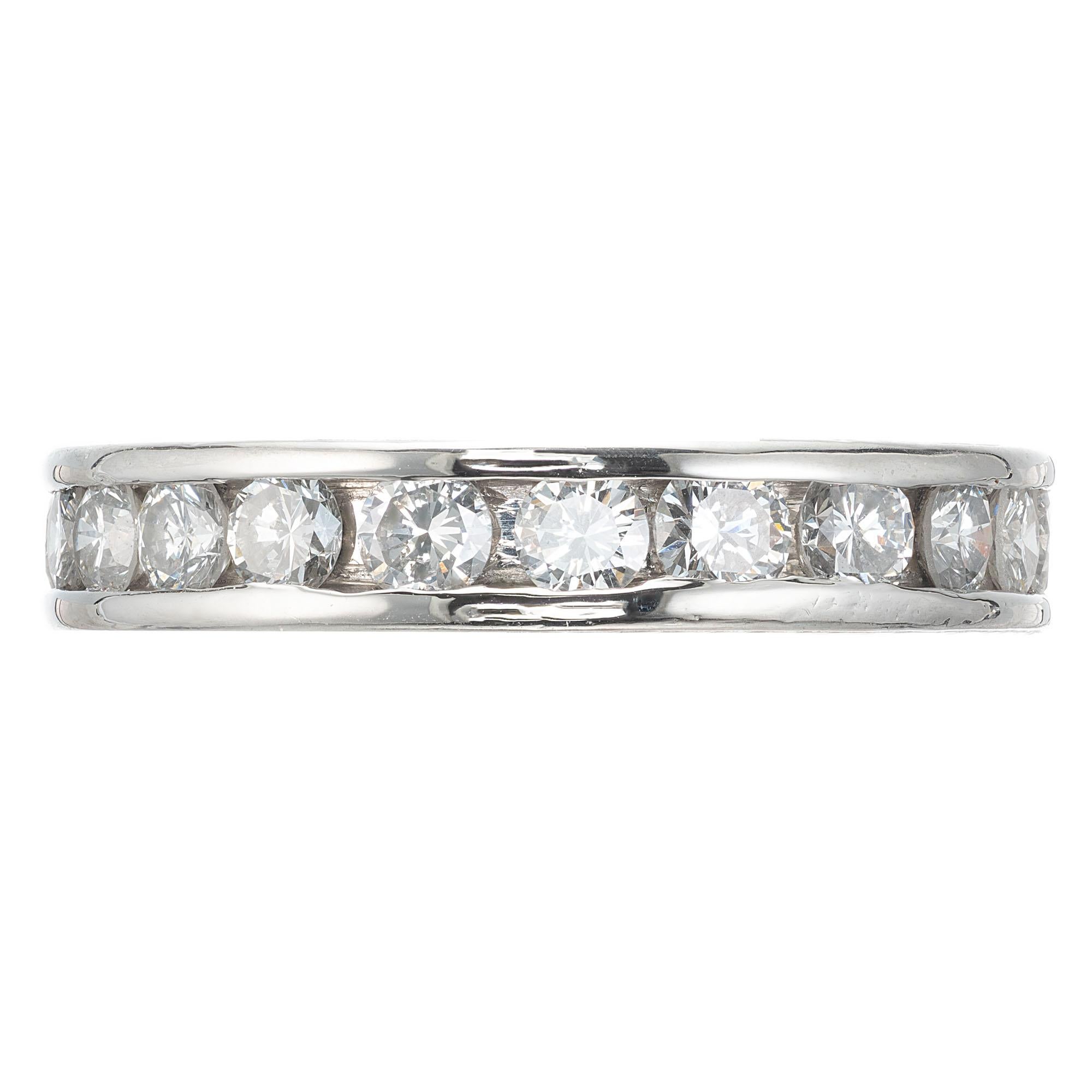 Diamond eternity plain channel set eternity band from the Peter Suchy workshop, with engraved sides and 1.55 carats of round diamonds. 

22 round brilliant cut diamonds G-H VS-SI, approx. 1.55cts
Size 6.75 
Platinum 
Tested: Platinum 
6.4